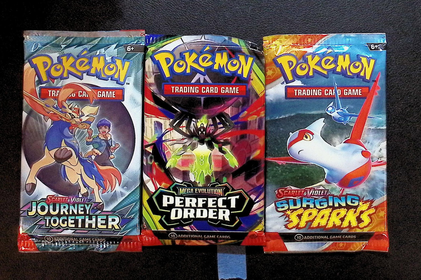 3 COUNT: 1 - Pokemon Journey Together, 1 - Perfect Order, & 1 - Surging Sparks Booster Packs: Pokemon Trading Card Game Cards, Charizard, Pikachu, Mewto, EX, Referse Holo, Holo Rare Cards, Secret Rare Cards, Full Art Cards, Evee, 3 Stars Ultra Rare Cards, Double Rare, Illustration Rare, Specia