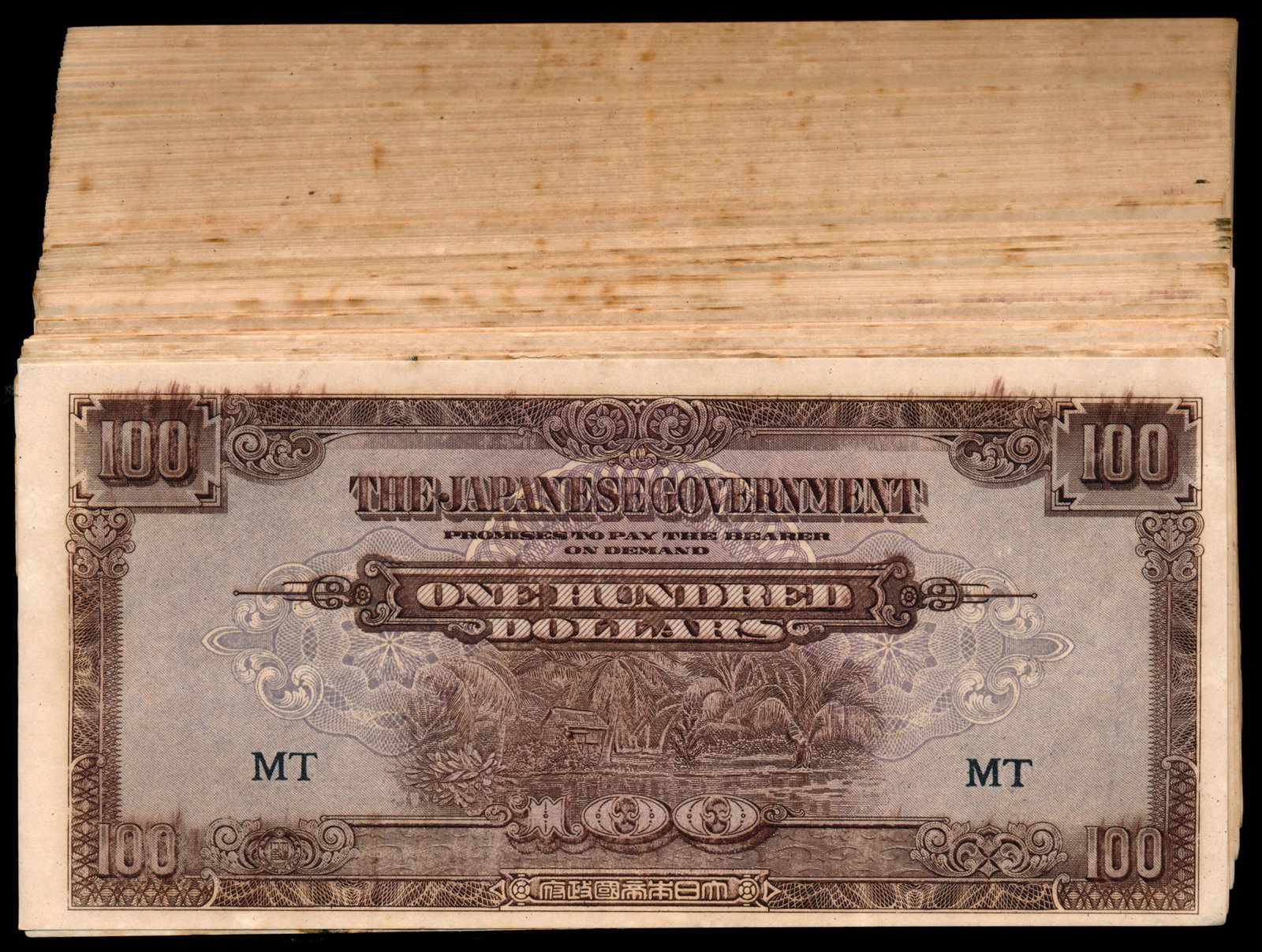 Malaya Jap Govt 100x$100 1944: Malaya Japanese Government, $100, ND (1944), (P.M8), block MT, stains, ageing, generally VF-AU. Viewing recommended, sold as is, no return. (100)