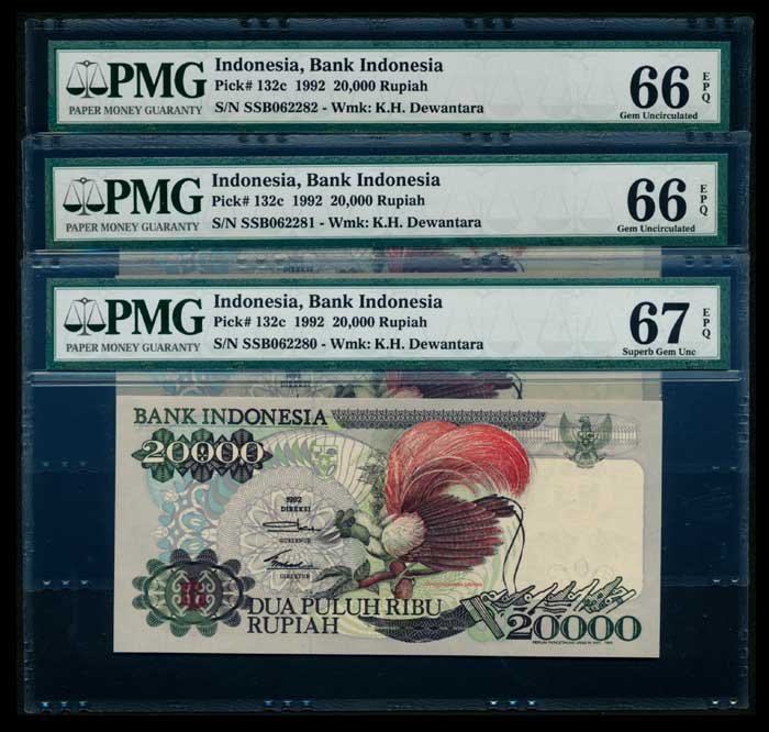Indonesia 3x20000 Rupiah 1992 PMG: Indonesia Bank Indonesia, 20000 Rupiah, 1992, (P.132c; H-329), serial nos. SSB 062280 to 282, 3 consecutive notes, 1st note graded PMG Superb Gem UNC67EPQ, all others graded PMG Gem UNC66EPQ. (3)