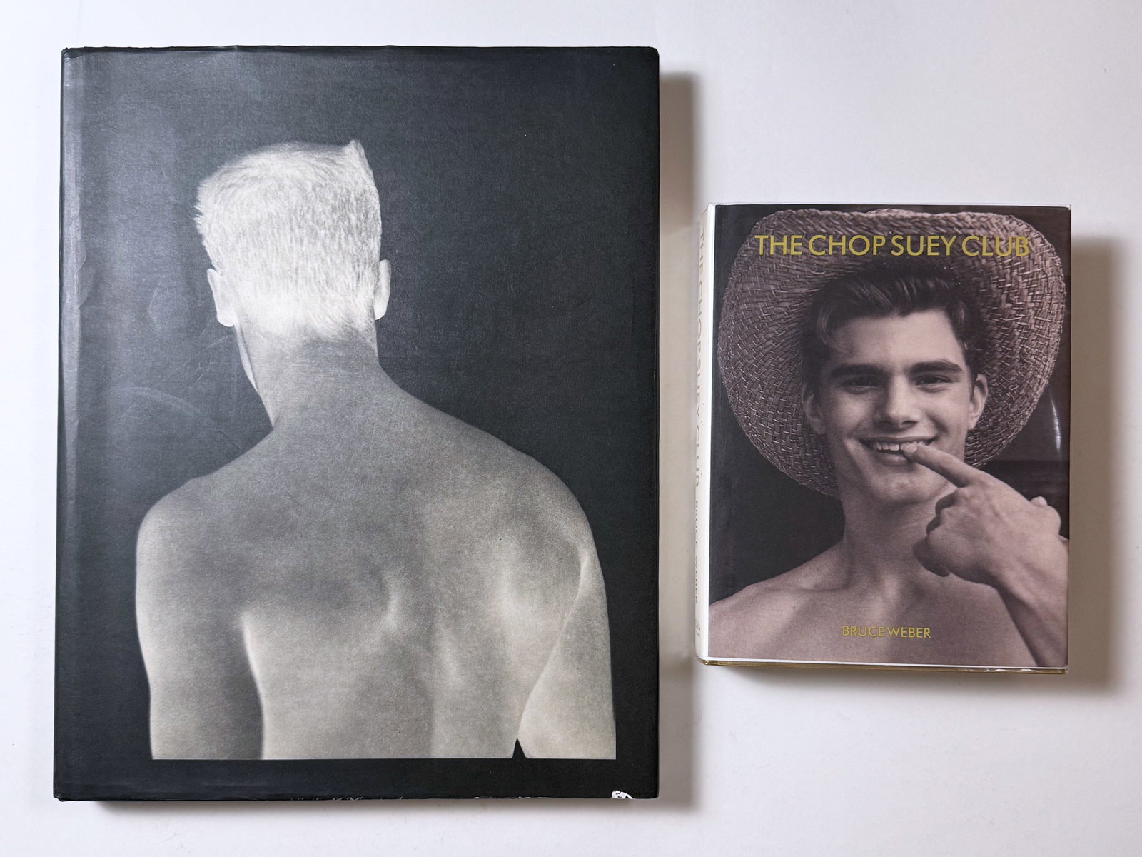 "Chop Suey Club" and "Bruce Weber" by Bruce Weber Lot of 2 Gay Male Interest Nude Books: Chop Suey Club presents Bruce Weber's collection of photographs mostly of a young man he met while shooting at a wrestling camp. Taken over a series of years, the photographs evolve in scope and invol