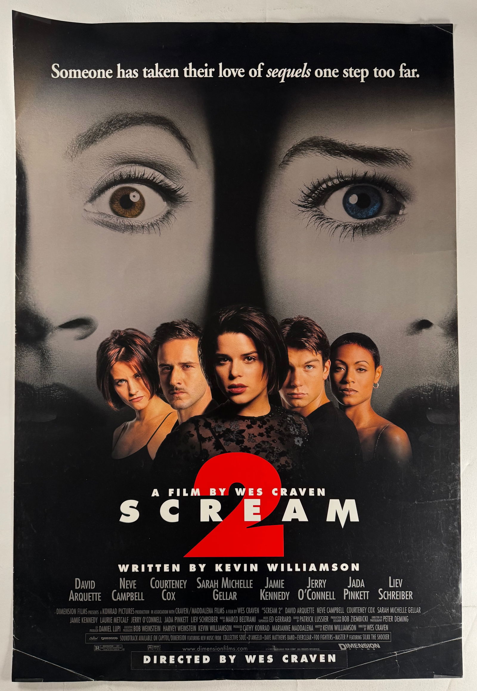 Scream 2 Original Single Side One Sheet 27x41 Movie Poster Neve Campbell: Scream 2 is a 1997 American slasher film directed by Wes Craven and written by Kevin Williamson. It stars David Arquette, Neve Campbell, Courteney Cox, Sarah Michelle Gellar, Jamie Kennedy, Laurie Met