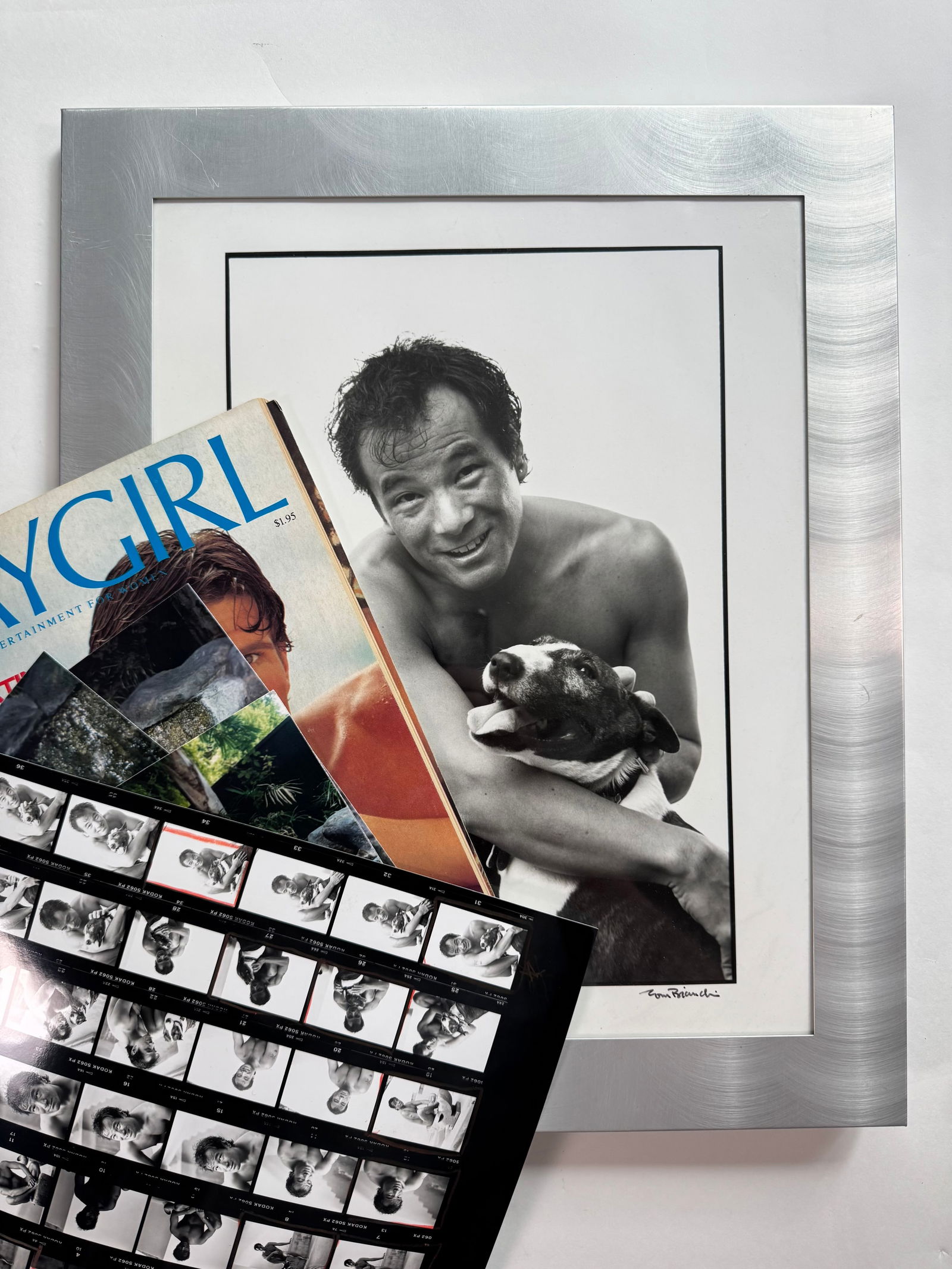 Lot of 2 Tom Bianchi Original Signed Silver Gelatin Photograph Proofs of Gil Kaan and Dog 7.5x9.5: Tom Bianchi photographed Gil in the early 2000s and gifted the proofs and contact sheets to Gil. Photo 7.5x9.5 Frame 10.5x12.5 - Also includes one contact sheet, 3 photos of Gil in the pool and a Play