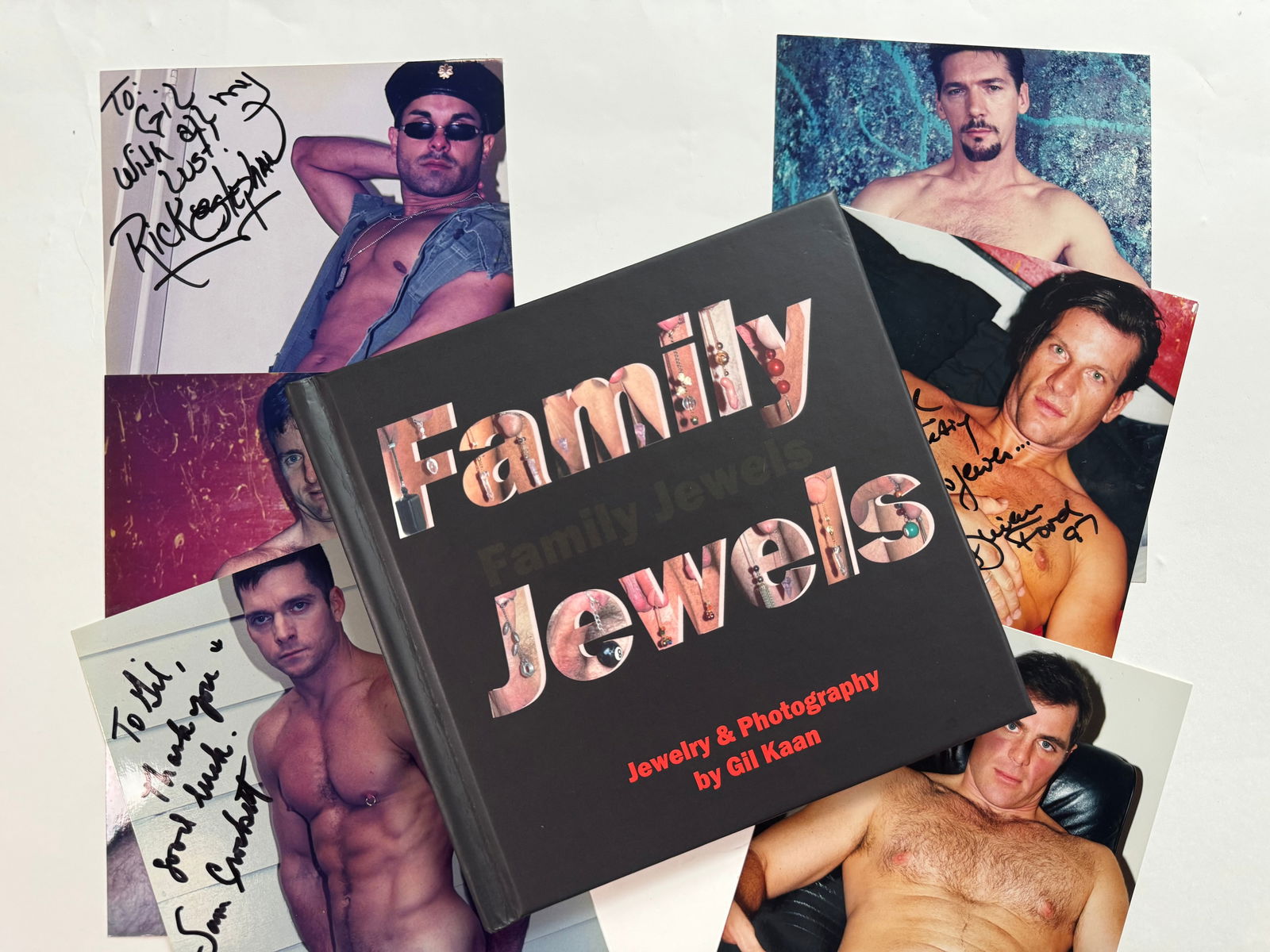 Family Jewels by Gil Kaan with Adult Model Signed Photos: Gil developed a line of "male downstairs jewelry" and had adult stars model them for a self published mini book. Included is the book plus 6 signed and inscribed photos of the stars wearing the jewelr