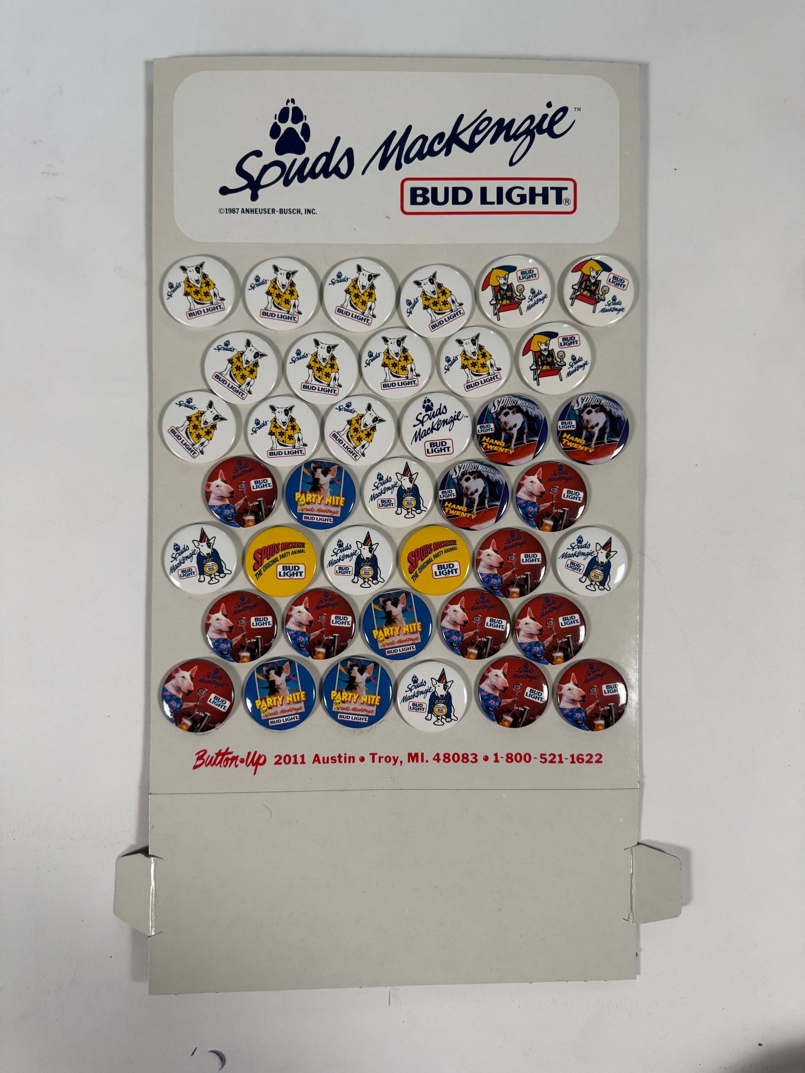 Lot of full set of 39 Bud Light Spuds McKenzie Button Display: From the estate of a Spuds McKenzie collector.