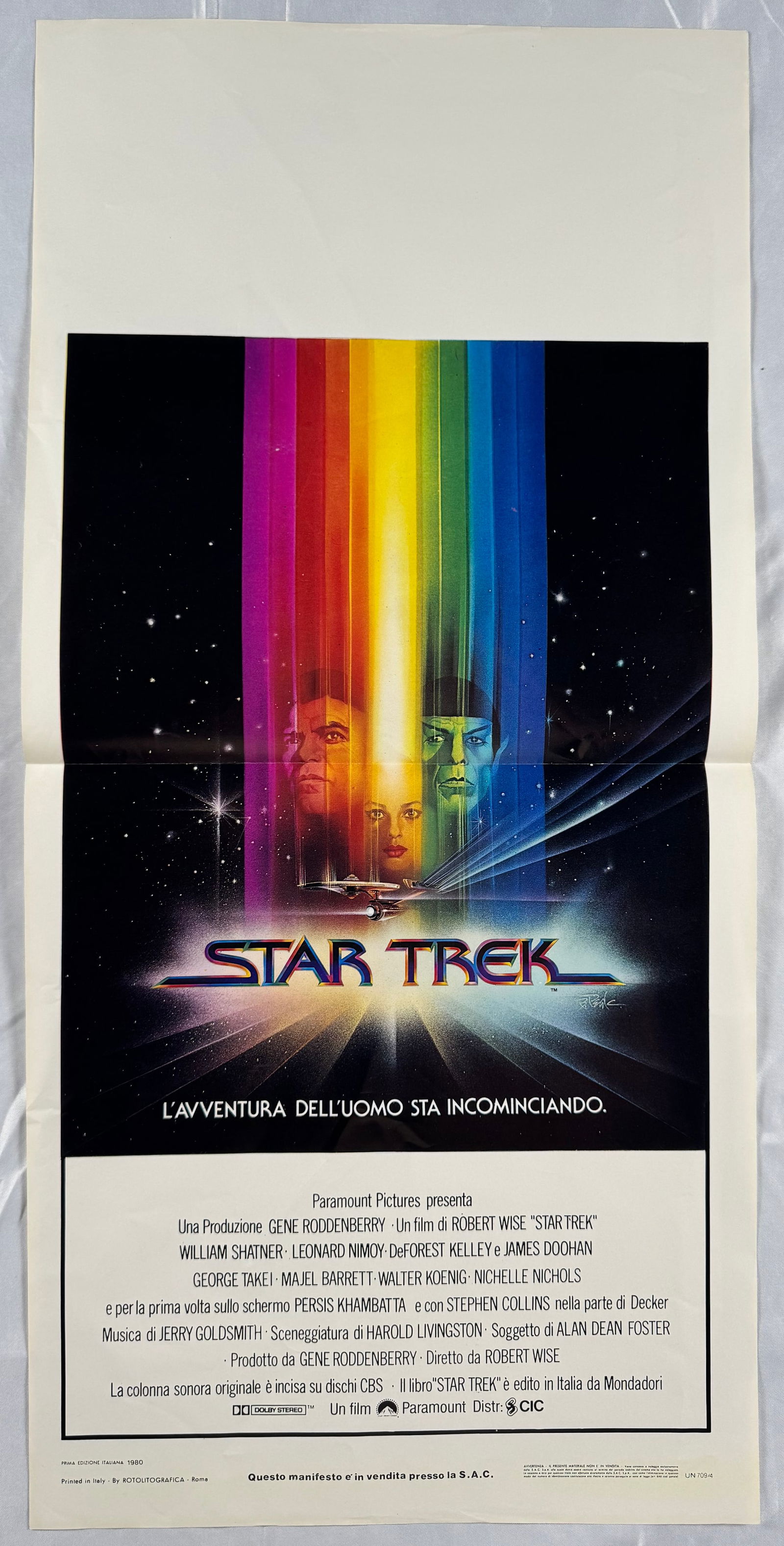 Star Trek: The Motion Picture 1979 Original Italian Locandino Folded Movie Poster 13"x27.5" William: Star Trek: The Motion Picture is a 1979 American science fiction film directed by Robert Wise. The Motion Picture is based on and stars the cast of the 1966–1969 television series Star Trek created