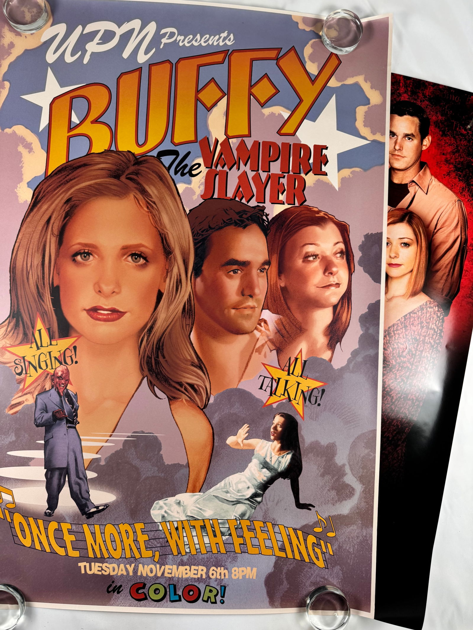 Lot of 2 Original Buffy the Vampire Slayer TV Show UPN Promo Posters Including “Once More, With: Two UPN promotional posters for the Buffy the Vampire Slayer including the rare musical episode “Once More, With Feeling,” printed in a retro, comic-style layout with vibrant colors; overall c