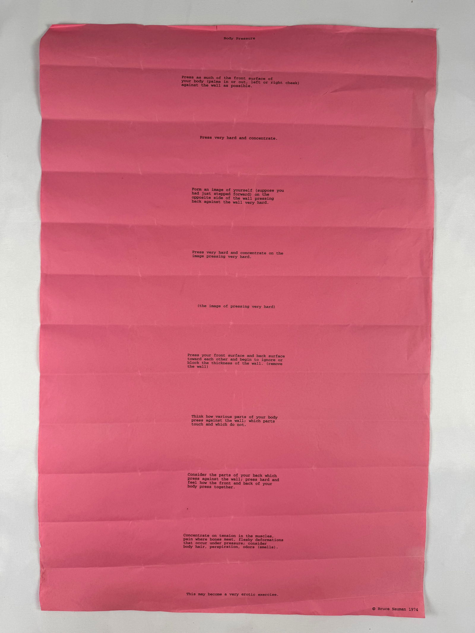 Bruce Nauman “Body Pressure?? 1974 Text Work Possibly Original: A pink-page typed text work of Bruce Nauman's “Body Pressure” instructions from 1974, featuring conceptual performance prompts; heavy fold lines throughout and signs of handling add to its arc