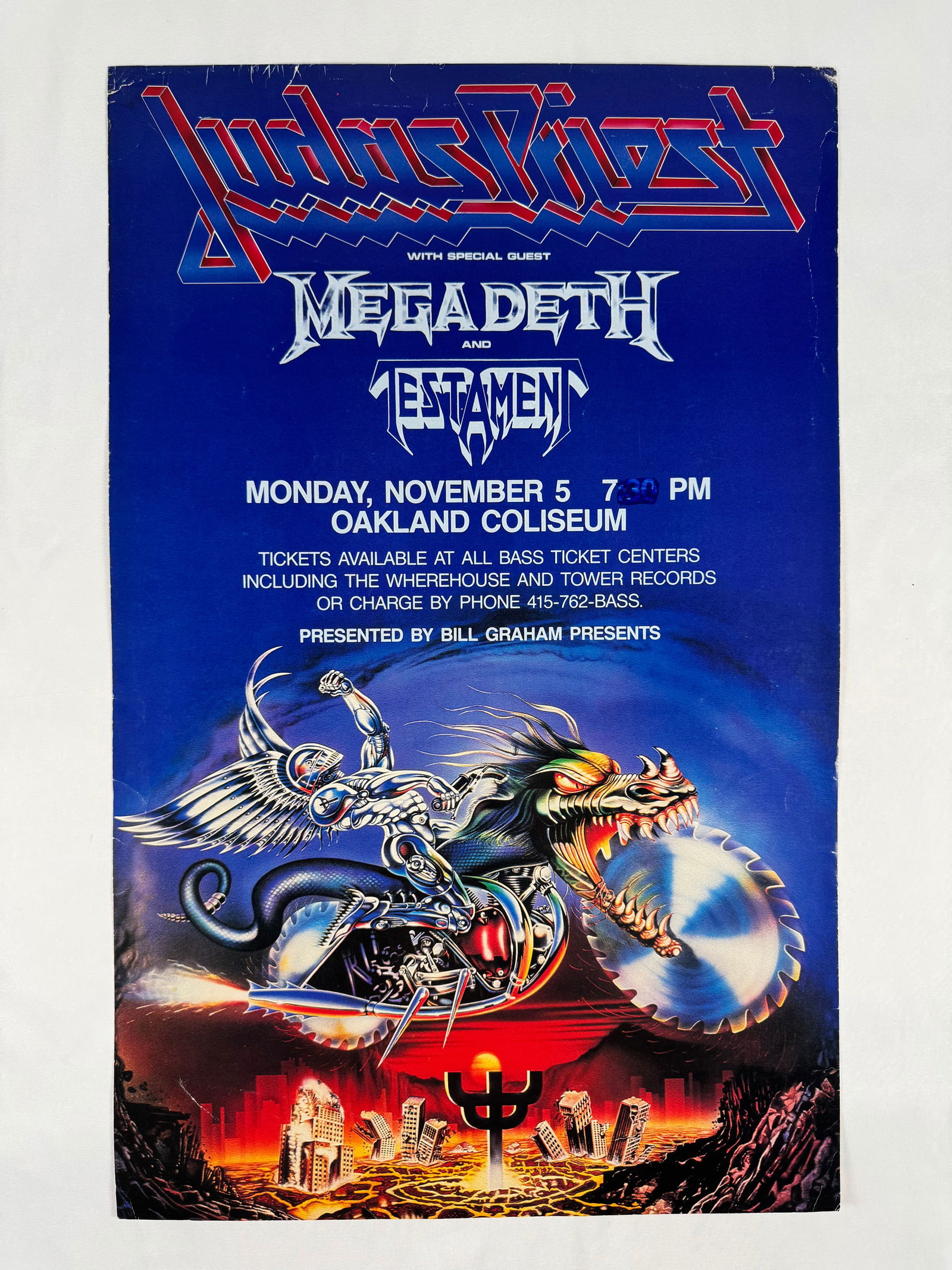 Judas Priest Megadeth Testament Oakland Coliseum Concert Poster: This description matches the Judas Priest, Megadeth and Testament concert poster for the Oakland Coliseum on November 5, presented by Bill Graham Presents. A significant metal lineup from the period.