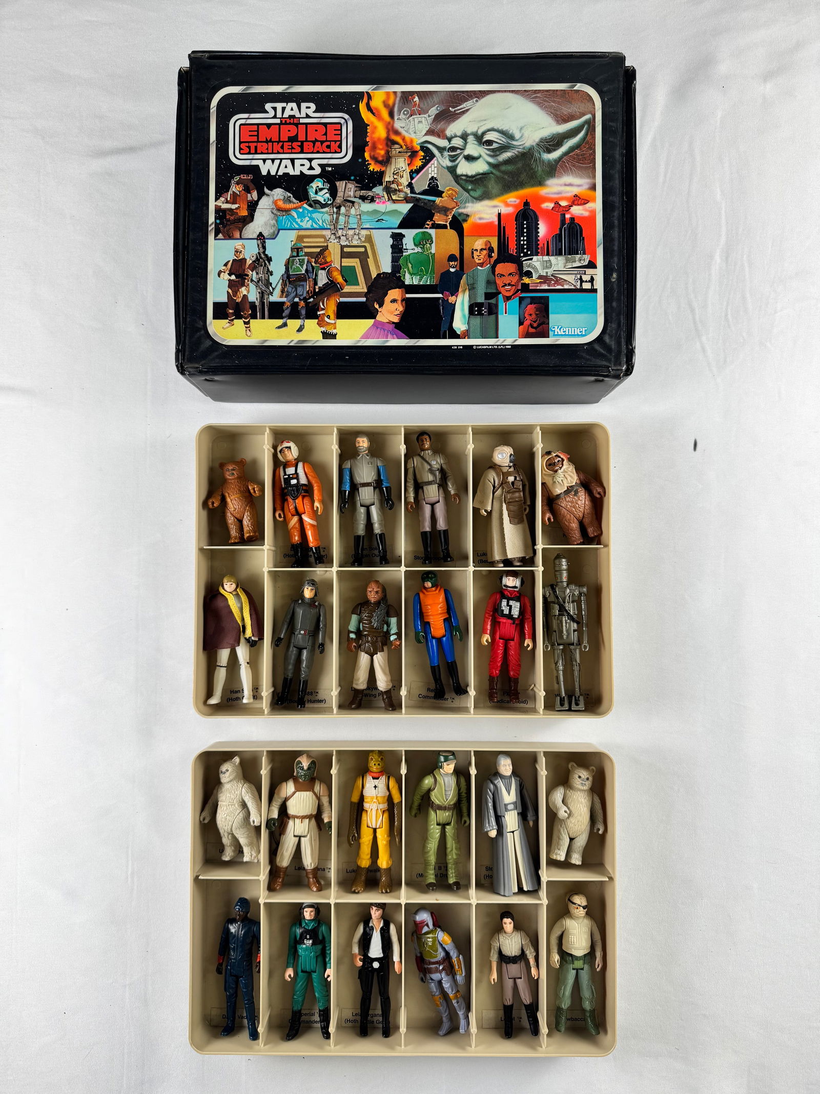 Star Wars The Empire Strikes Back Kenner Case with Figures: Kenner Star Wars figure case with illustrated Empire Strikes Back lid. Includes plastic trays containing multiple action figures. To the best of our knowledge, all characters are mixed from the origin