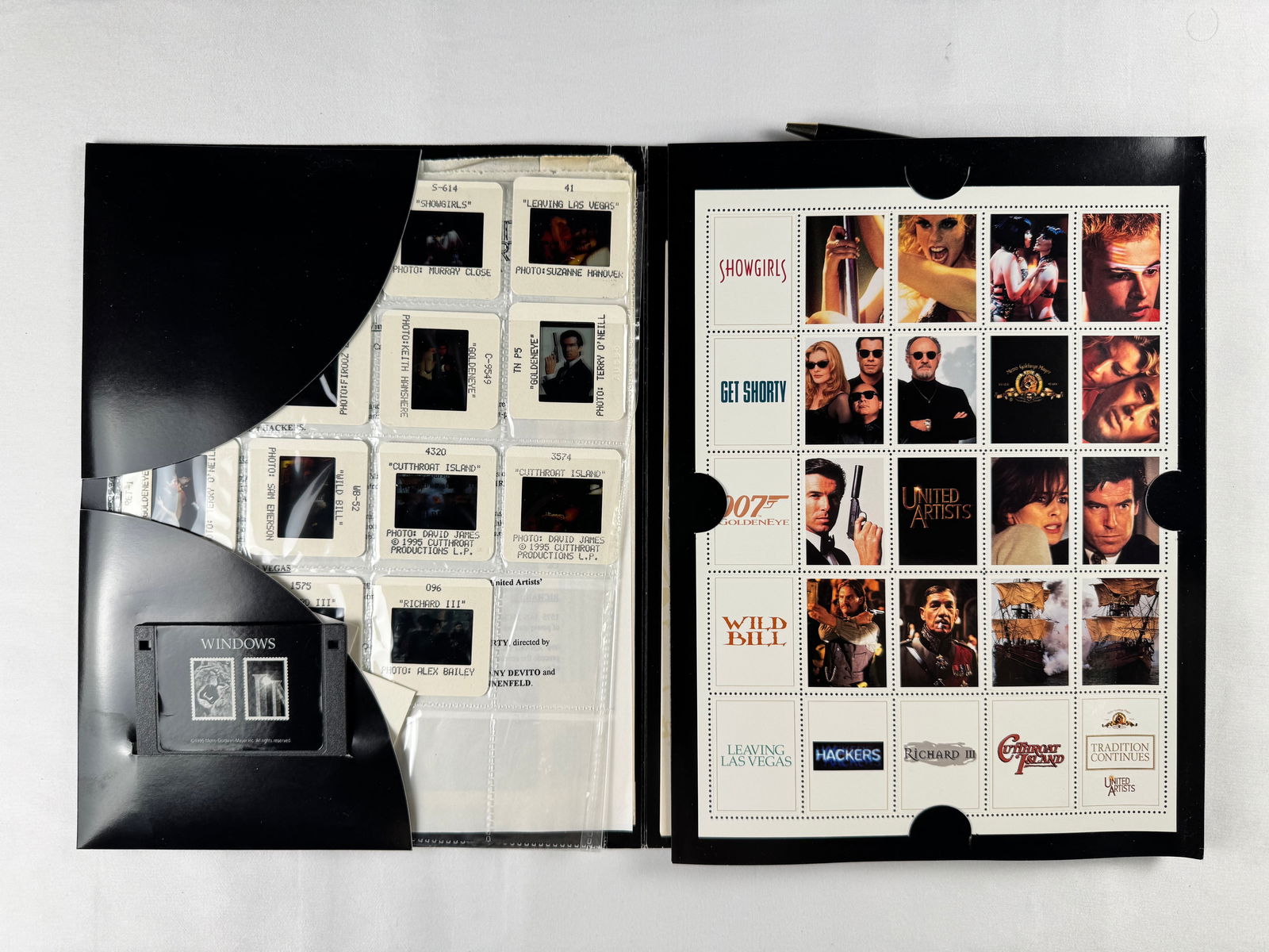 United Artists Film Slide Transparency Promotional Binder: Promotional binder containing multiple film slide transparencies from United Artists releases. Includes labeled slide sleeves and studio-issued presentation materials.