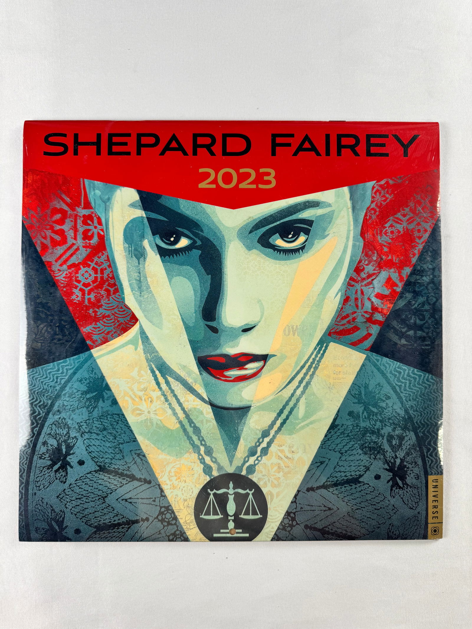 Shepard Fairey 2023 Sealed Calendar: Sealed 2023 calendar featuring artwork by Shepard Fairey. Calendar remains factory sealed in original packaging.