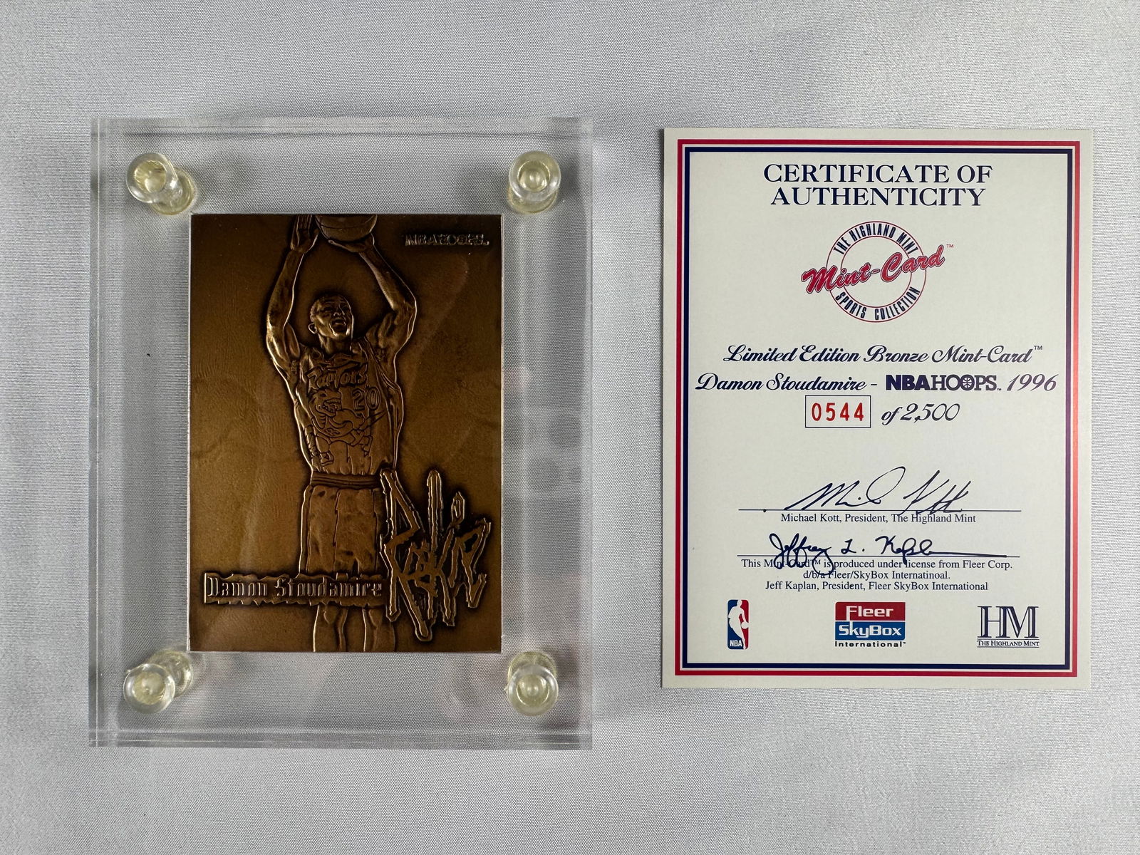 Damon Stoudamire 1996 NBA Hoops Bronze Mint Card with COA: Bronze Mint Card featuring Damon Stoudamire issued by The Highland Mint in 1996. Includes original Certificate of Authenticity.