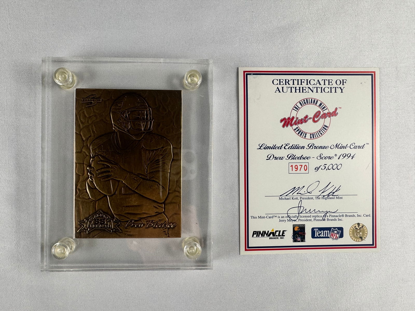 Drew Bledsoe Score 1994 Limited Edition Bronze Mint Card with COA: Bronze relief card featuring Drew Bledsoe based on his 1994 Score card. Issued by The Highland Mint and accompanied by its certificate of authenticity.