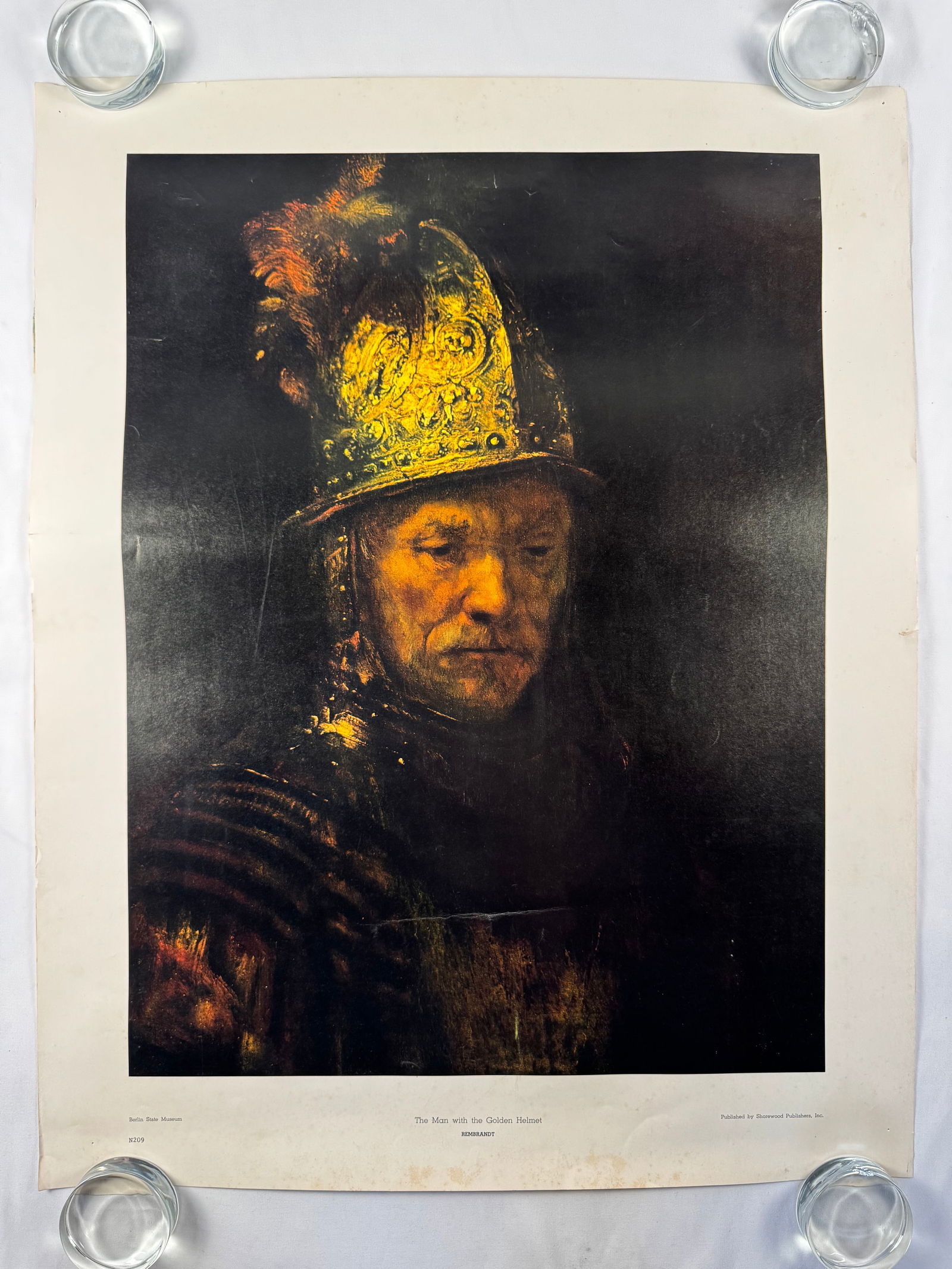 Rembrandt The Man with the Golden Helmet Poster Art Print Poster Berlin State Musuem: Rembrandt Harmenszoon van Rijn (15 July 1606 – 4 October 1669), mononymously known as Rembrandt, was a Dutch Golden Age painter, printmaker, and draughtsman. He is generally considered one of the gr