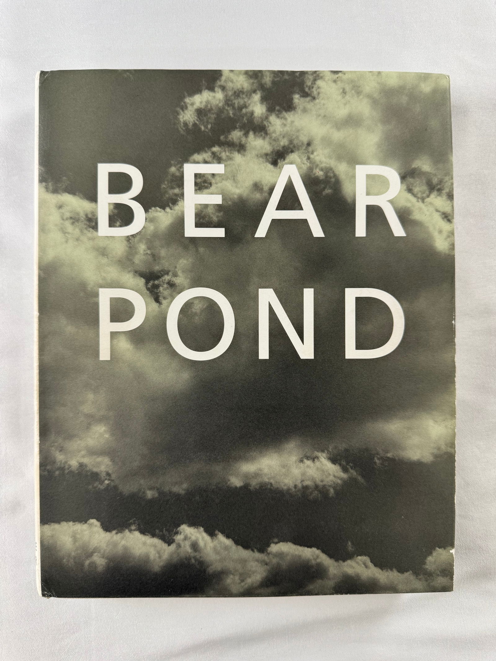 Bear Pond Photography Book – Gay Interest Photography: Photography book titled Bear Pond featuring cloud imagery on the cover. No photographer is credited on the front cover.
