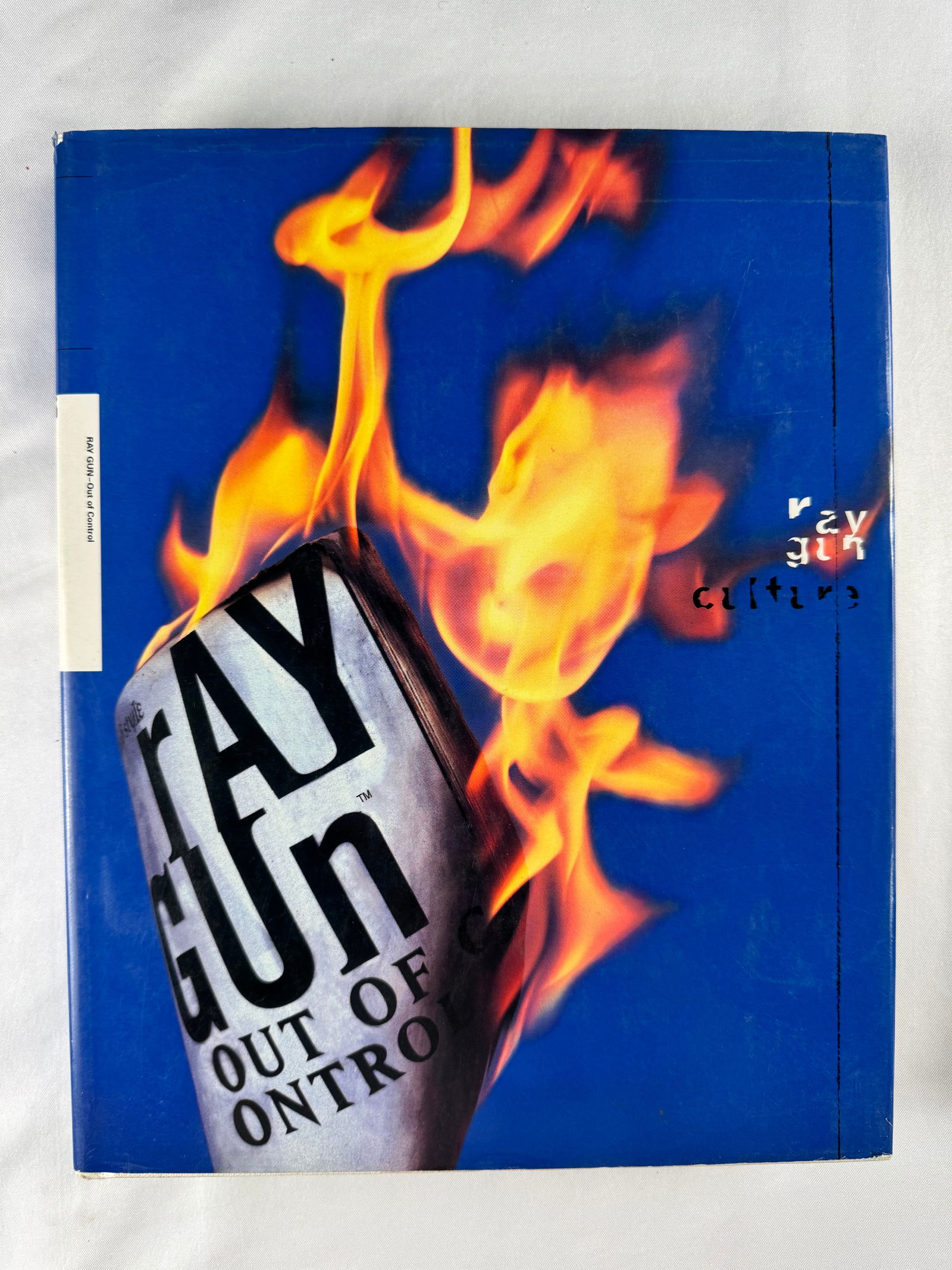Ray Gun Out Of Control Magazine Design Hardcover Book 1995: Design and culture publication titled Ray Gun Out Of Control released in 1995. Associated with Ray Gun magazine and its experimental graphic design era.
