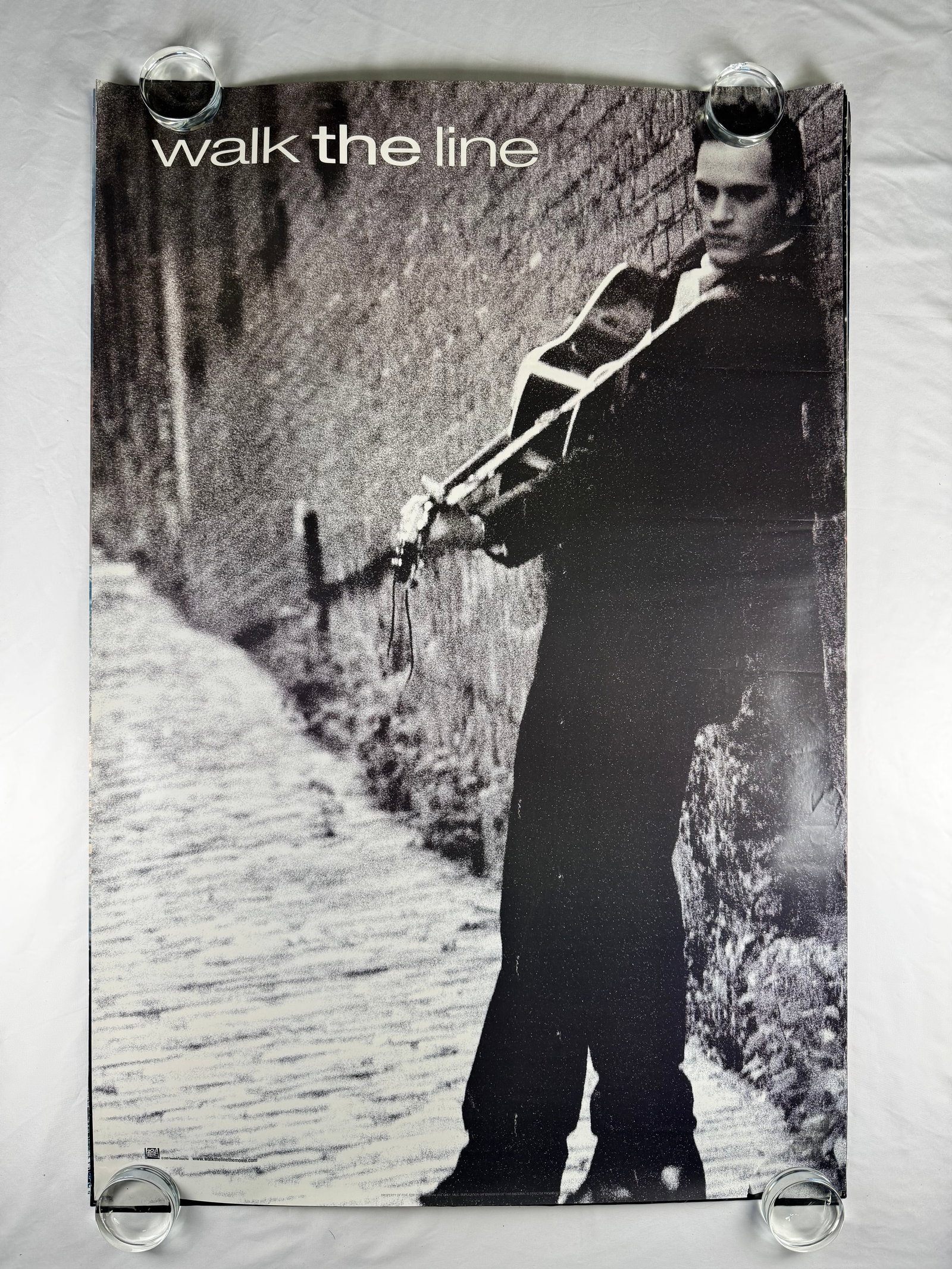 Walk the Line Original One Sheet Movie Poster 27"x40" 2005: Original theatrical movie poster for Walk the Line released in 2005 starring Joaquin Phoenix, Reese Witherspoon, and Ginnifer Goodwin. Biographical drama directed by James Mangold.