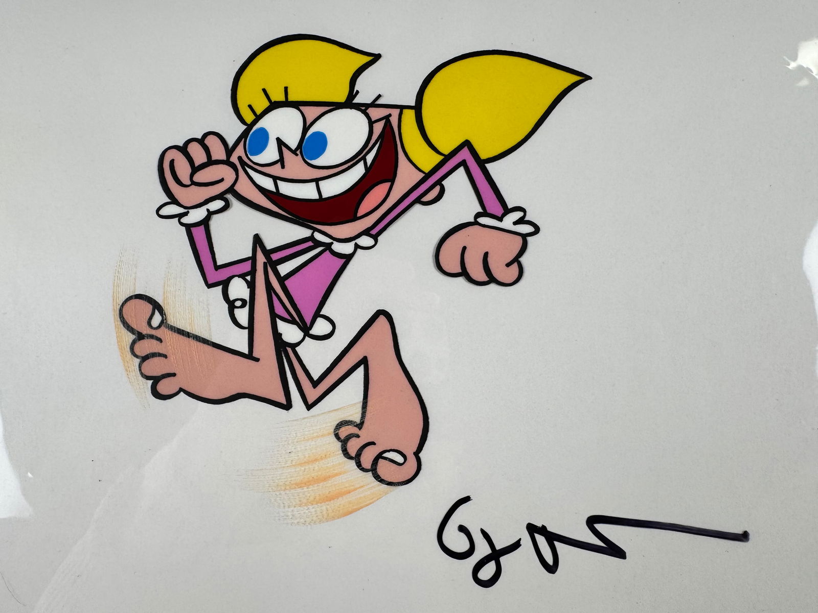 Dexter’s Laboratory Original Production Animation Cel Signed Genndy Tartakovsky Dee Dee TV Show: This original animation production cel depicts Dee Dee in a running pose from Dexter’s Laboratory. The cel is signed by Genndy Tartakovsky.
