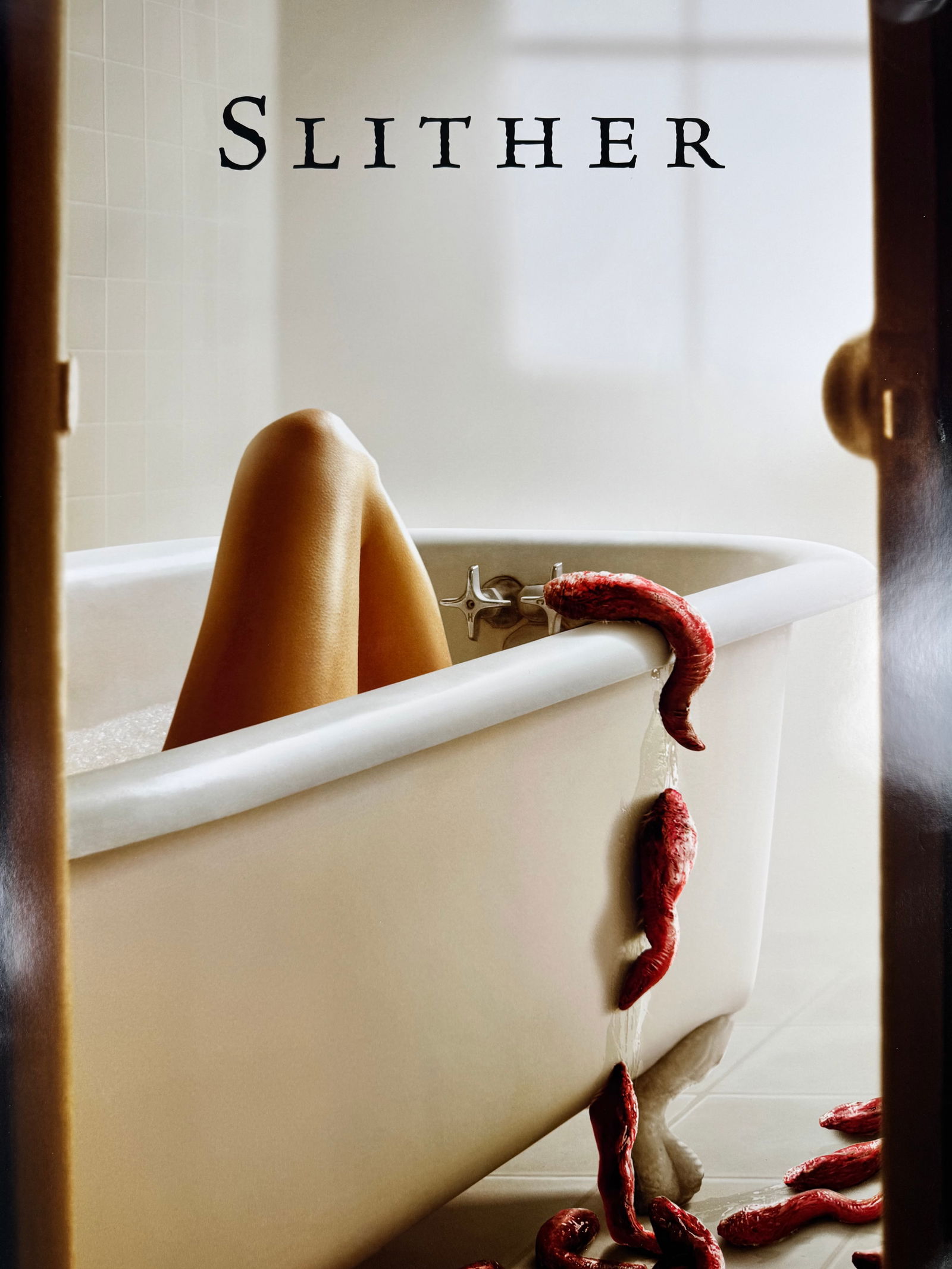 Slither (2006) Original One Sheet Movie Poster James Gunn: Slither (2006) horror film poster directed by James Gunn and starring Nathan Fillion, Elizabeth Banks, and Michael Rooker. Science fiction horror film released by Universal Pictures.