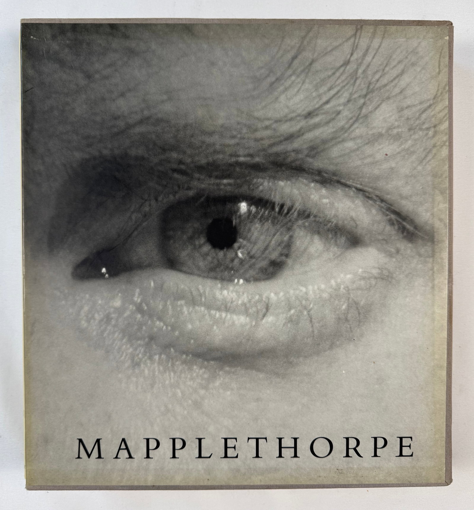 Robert Mapplethorpe 1992 First Edition Retrospective Art Book with Slipcase Hardcover: A first trade edition of the landmark 1992 Mapplethorpe retrospective, produced in collaboration with The Robert Mapplethorpe Foundation. This substantial volume contains more than 380 tritone black-a