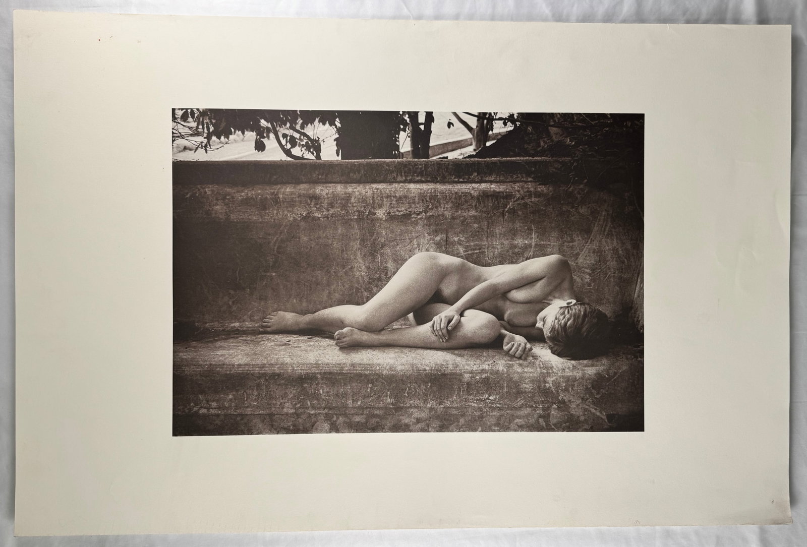Harvey Edwards Black and White Nude Photograph Reclining Female Nude Figure 38x25": Print by Harvey Edwards depicting a reclining nude female figure on a bench. Black and white photographic image presented within a wide margin format.
