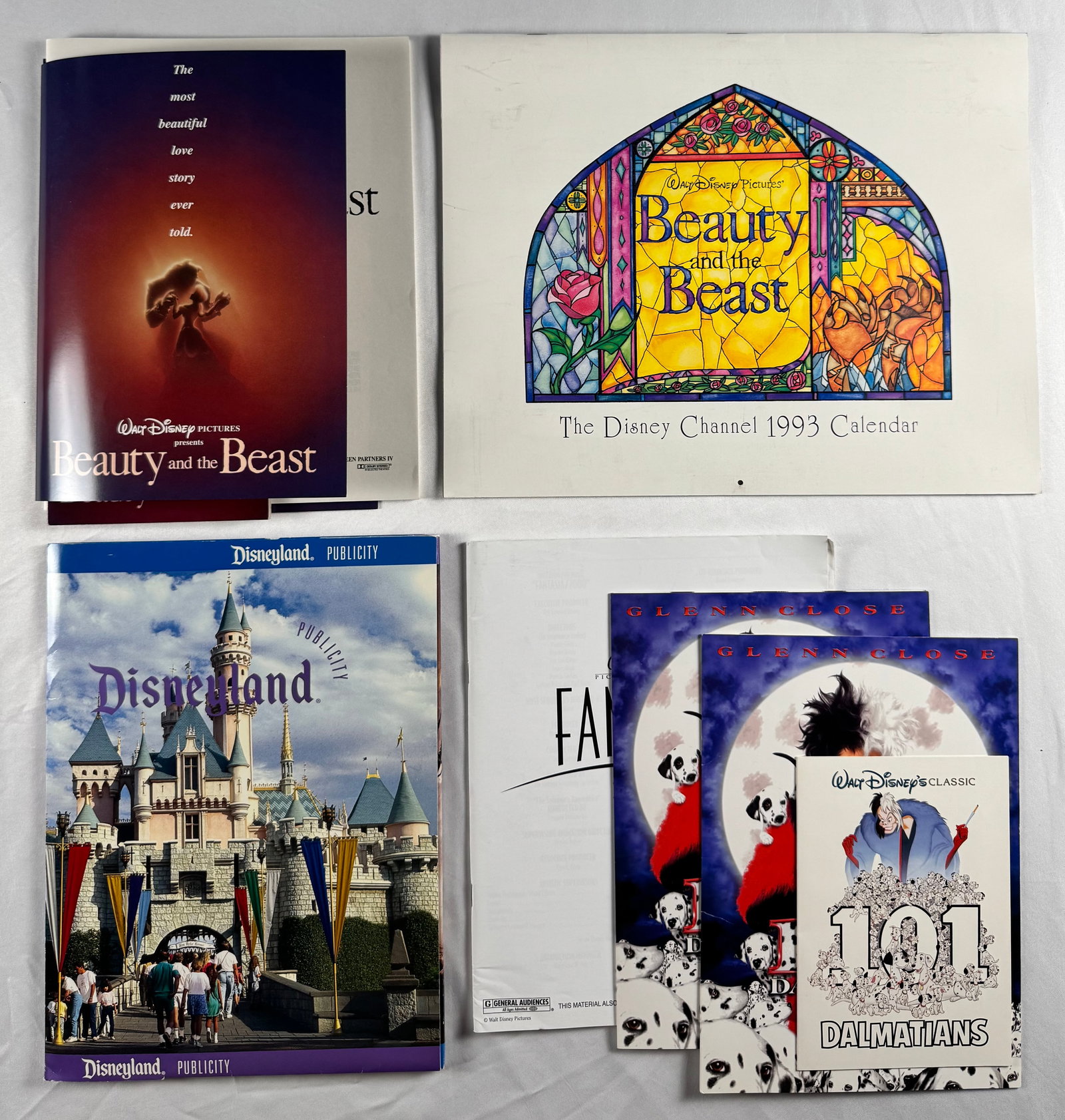Lot of Disney Press Kits Beauty and the Beast 101 Dalmatians Disneyland Calendar Publicity: Includes Walt Disney Pictures Beauty and the Beast materials, Disney Channel 1993 Calendar, Disneyland publicity book, and 101 Dalmatians materials. Printed promotional press items related to Disney f