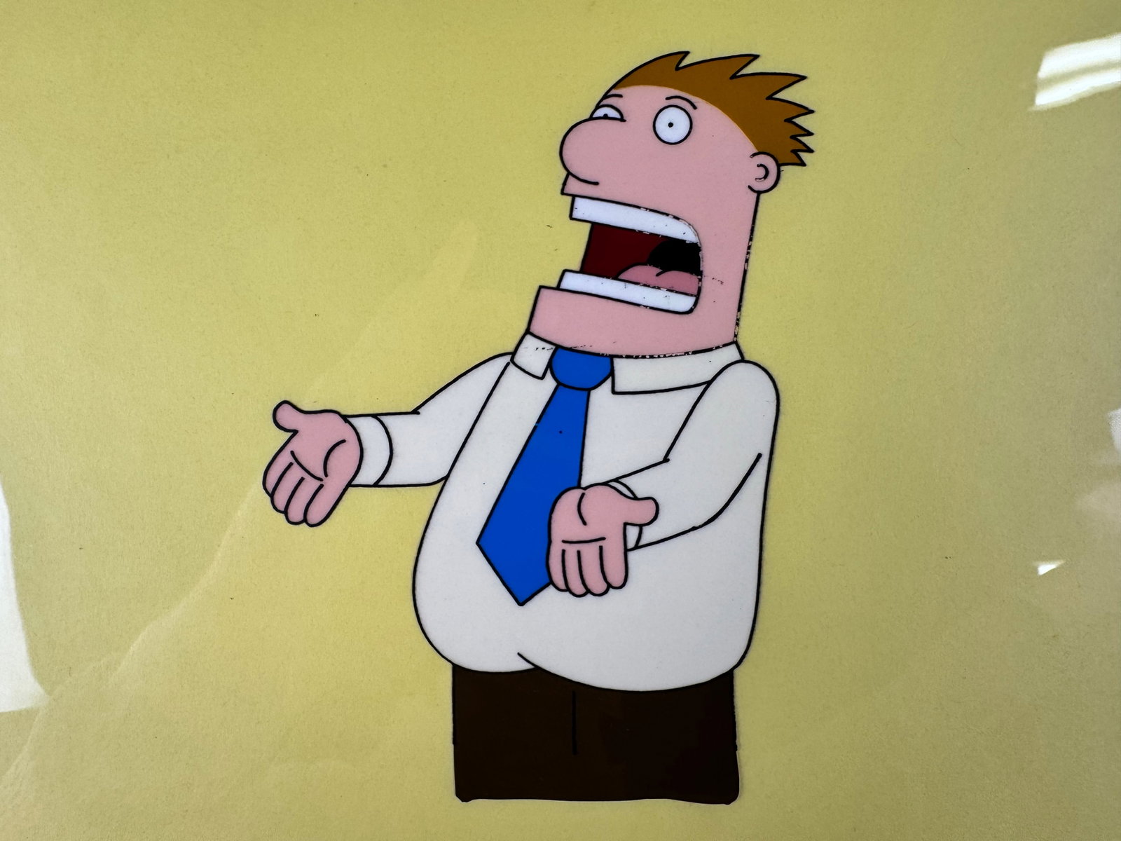 Dilbert Original Animation Production Cel Character Pose Signed Seth Kearsley COA: This original animation production cel depicts a supporting character from Dilbert against a yellow background. The cel is signed by Seth Kearsley and includes a certificate of authenticity.
