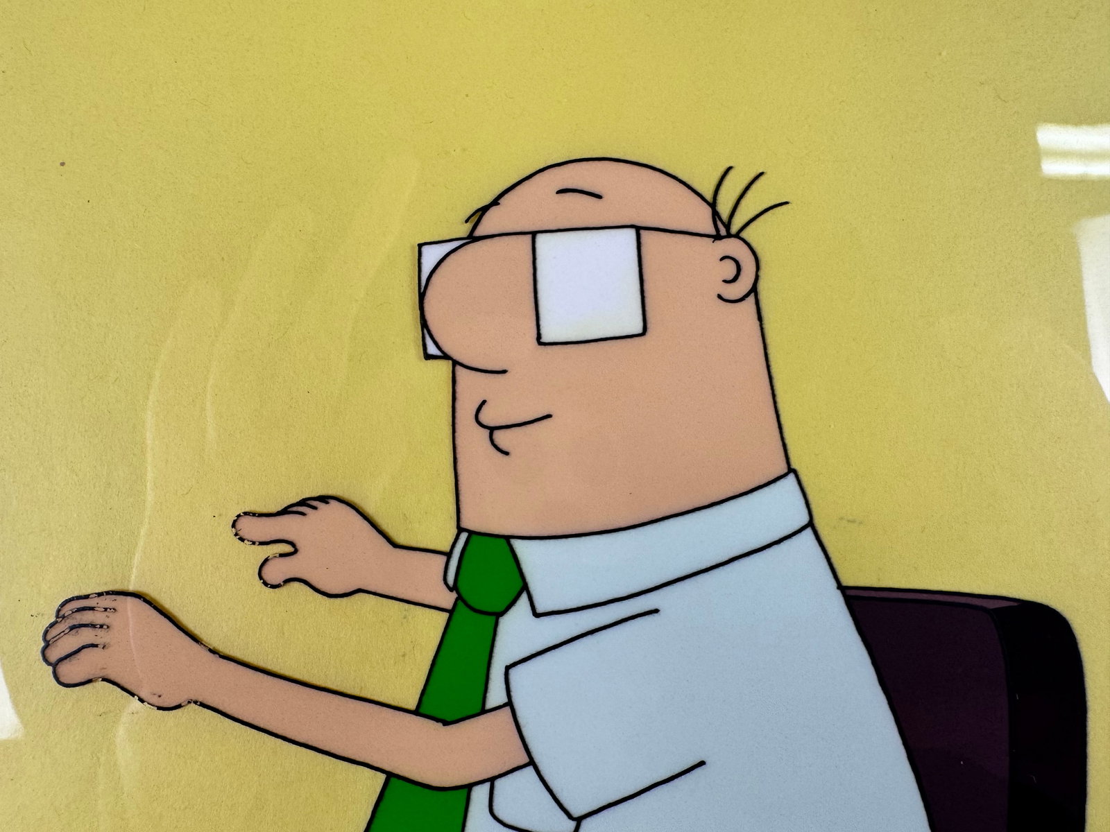Dilbert Original Animation Production Cel Wally Seated Signed Seth Kearsley COA: This original animation production cel depicts Wally seated against a yellow background. The cel is signed by Seth Kearsley and includes a certificate of authenticity.