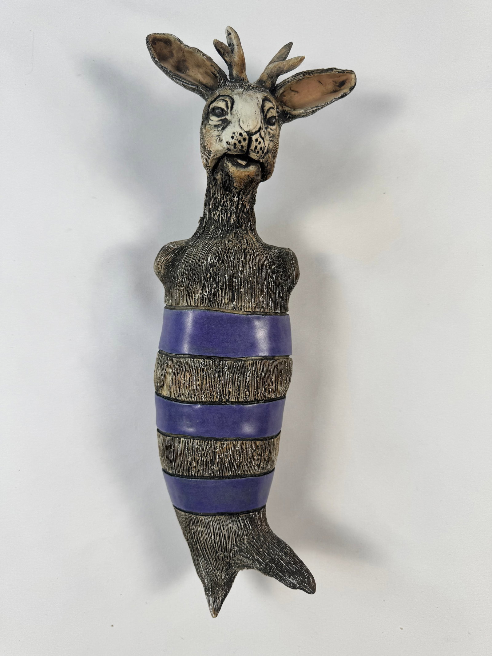 Diane Martin Lublinski Tiny Hero Ceramic Art Doll Wall Hanging Sculpture: Diane was born in New York City and grew up in South Florida where she continues to make her home. Born of Cuban Spanish parents gave her a rich multi cultural upbringing. She has developed a signatur