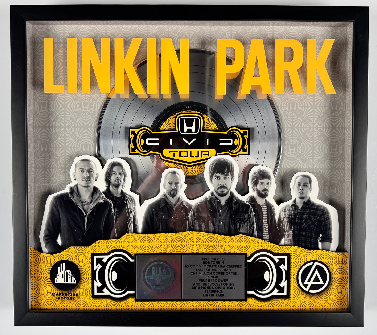 Linkin Park Burn It Down 2012 Honda Civic Tour RIAA Platinum Record Sales Award Display: Official RIAA-certified sales award commemorating more than one million copies sold of Linkin Park's single "Burn It Down" and the 2012 Honda Civic Tour. The custom shadowbox display features a platin