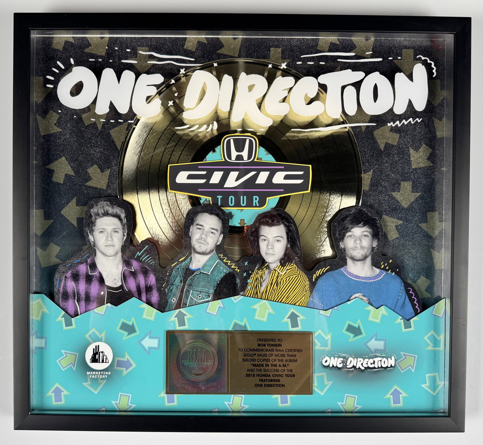One Direction Made in the A.M. 2016 Honda Civic Tour RIAA Gold Record Award Display: Official RIAA-certified gold sales award commemorating more than 500,000 copies sold of One Direction's album Made in the A.M. and the 2016 Honda Civic Tour. The shadowbox display features a gold reco