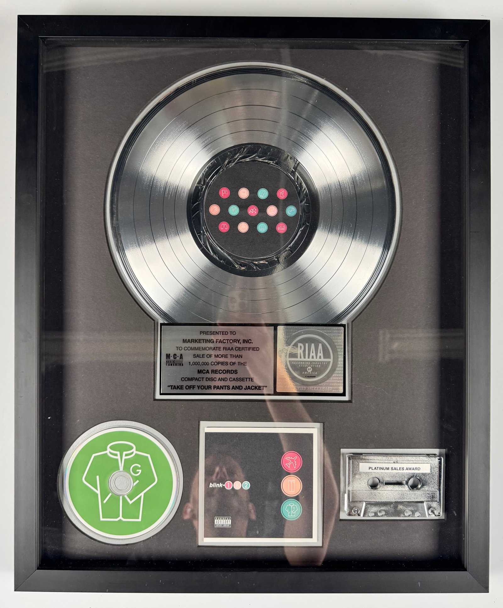 Blink-182 Take Off Your Pants and Jacket MCA RIAA Platinum Record Award Display: Official RIAA-certified platinum sales award commemorating more than 1,000,000 copies sold of Blink-182's MCA Records album Take Off Your Pants and Jacket. The display includes a platinum record, comp