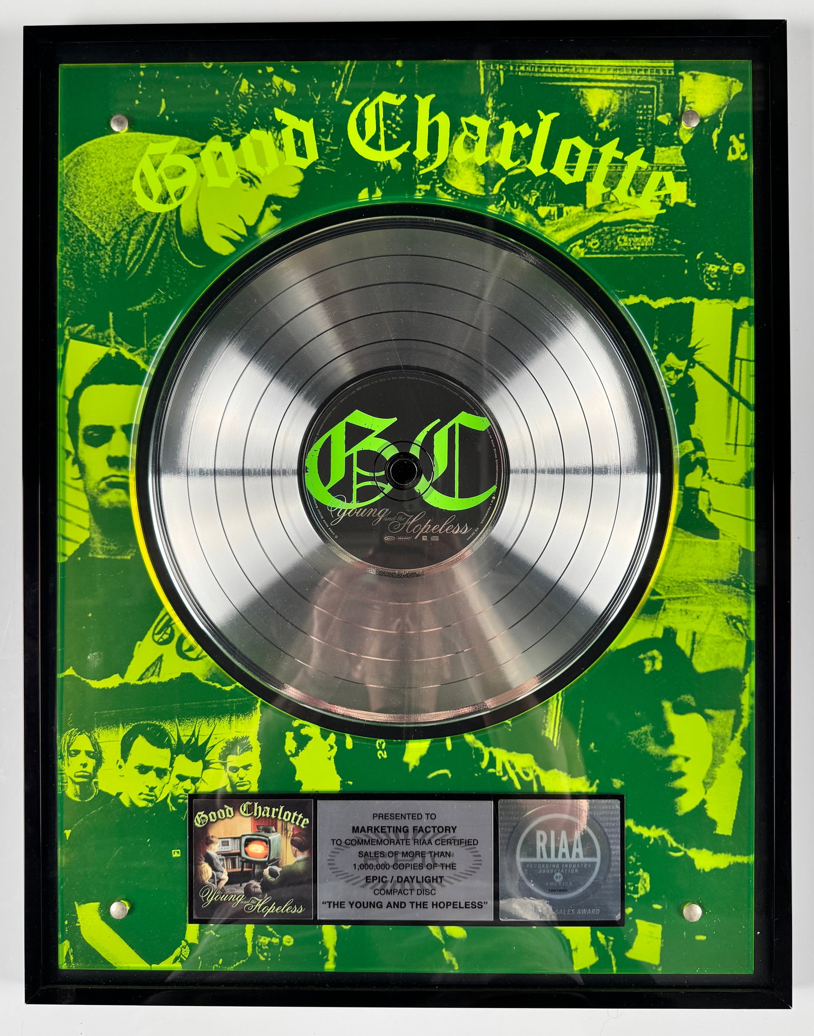Good Charlotte The Young and the Hopeless RIAA Platinum Record Sales Award Display: Official RIAA-certified platinum sales award commemorating more than 1,000,000 copies sold of Good Charlotte's album The Young and the Hopeless. The display features a platinum record, band imagery, a