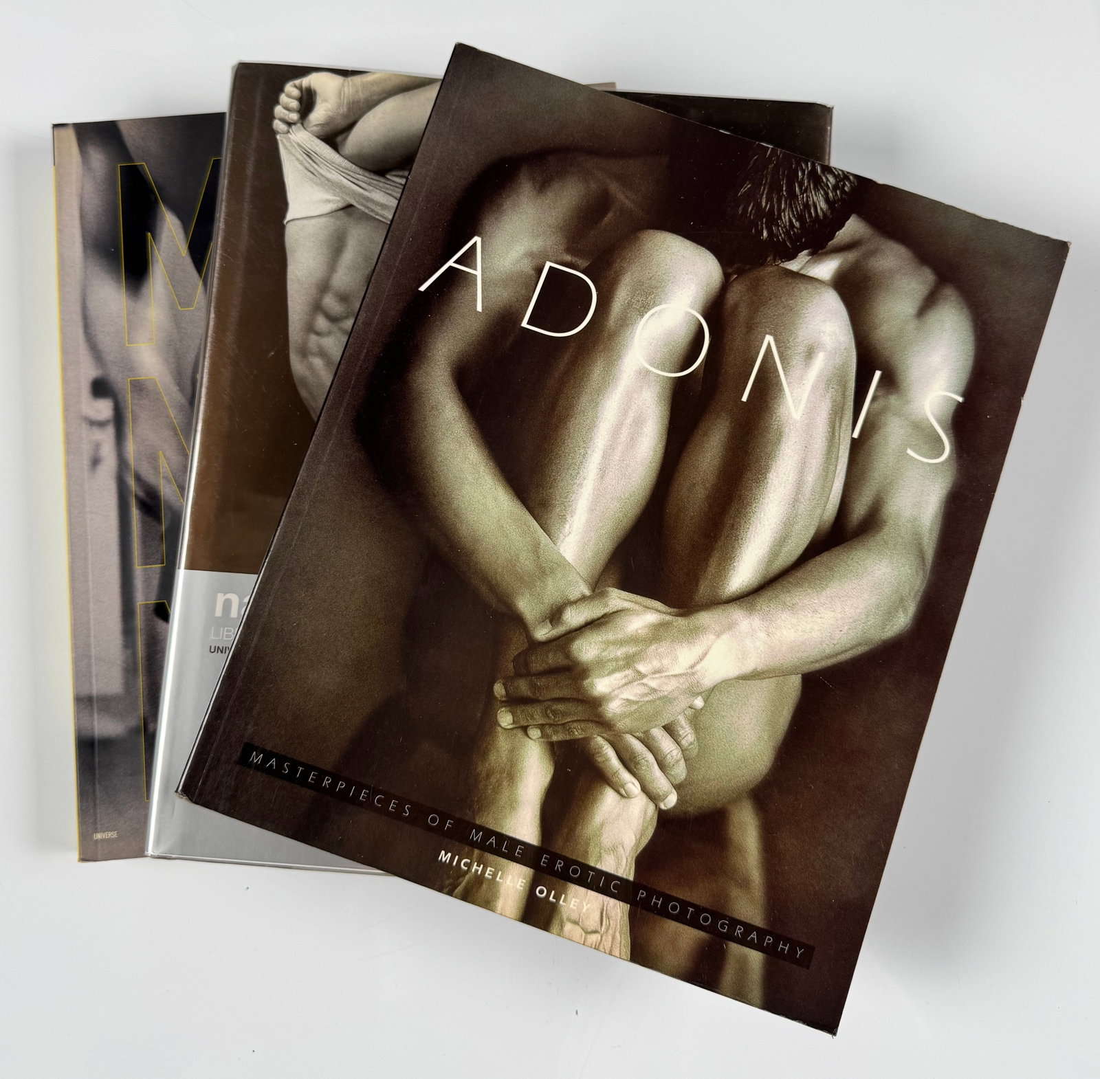 Adonis Naked Men Too Male Nude Now Gay Nude Male Interest Photography Book Lot: Lot of three illustrated gay interest photography books including *Adonis: Masterpieces of Male Erotic Photography* by Michel Olley, *Naked Men Too: Liberating the Male Nude 1950–2000* by David Ledd