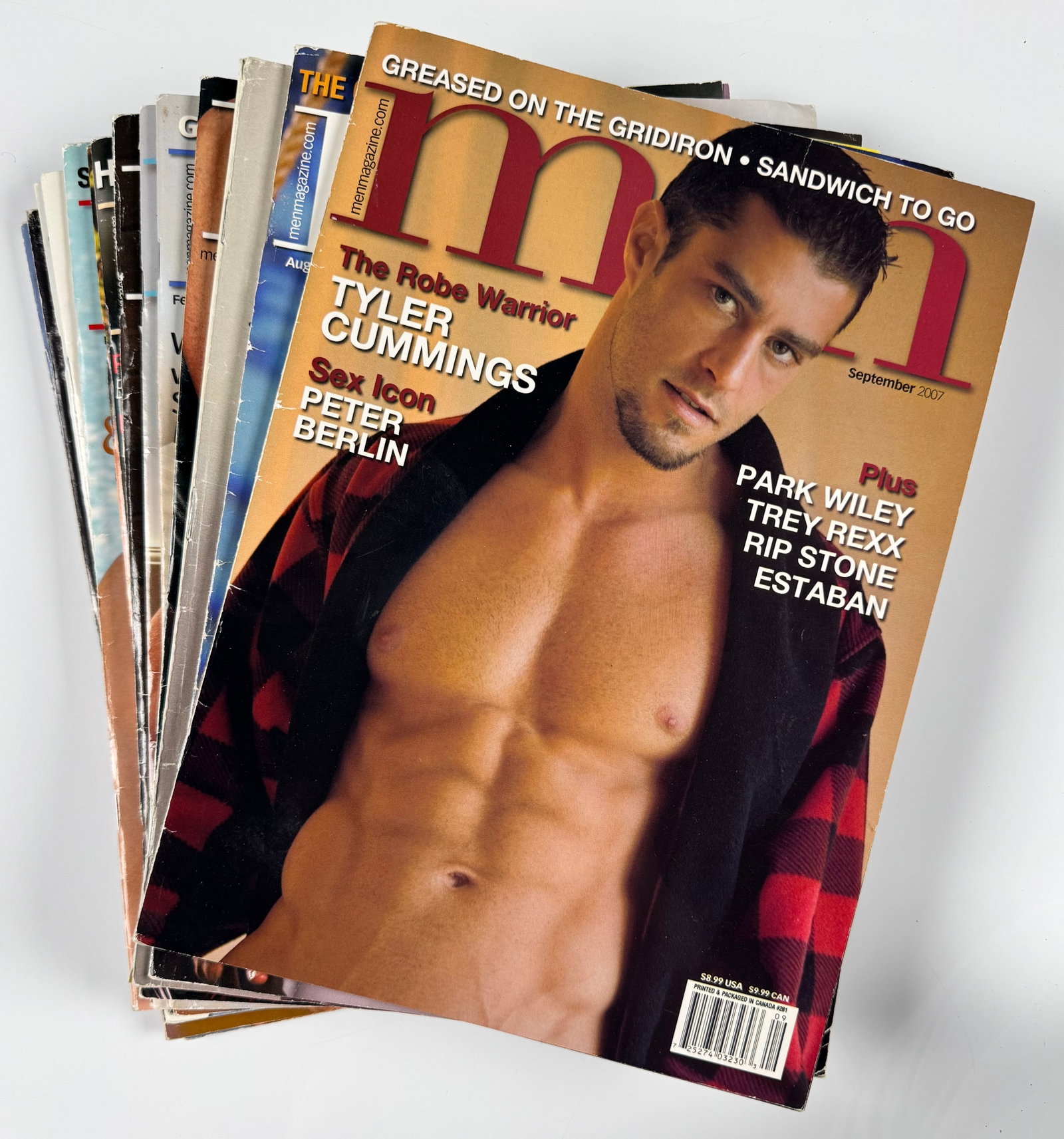 Lot of 14 MEN Magazines Tyler Cummings Peter Berlin Gay Nude Male Interest Collection: Approximately fourteen vintage issues of MEN magazine. Includes issues featuring Tyler Cummings, Peter Berlin, Rip Stone, Park Wiley, and other models. Features male photography, articles, interviews,
