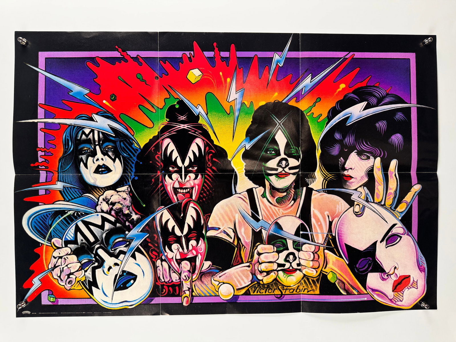KISS 1978 Original Aucoin Rock Steady Promotional Fold Out Poster Vintage Glam Rock Band: Formed in New York City in 1973 by Paul Stanley, Gene Simmons, Peter Criss, and Ace Frehley, the American rock band is celebrated for its elaborate live performances and distinct face paint designs.