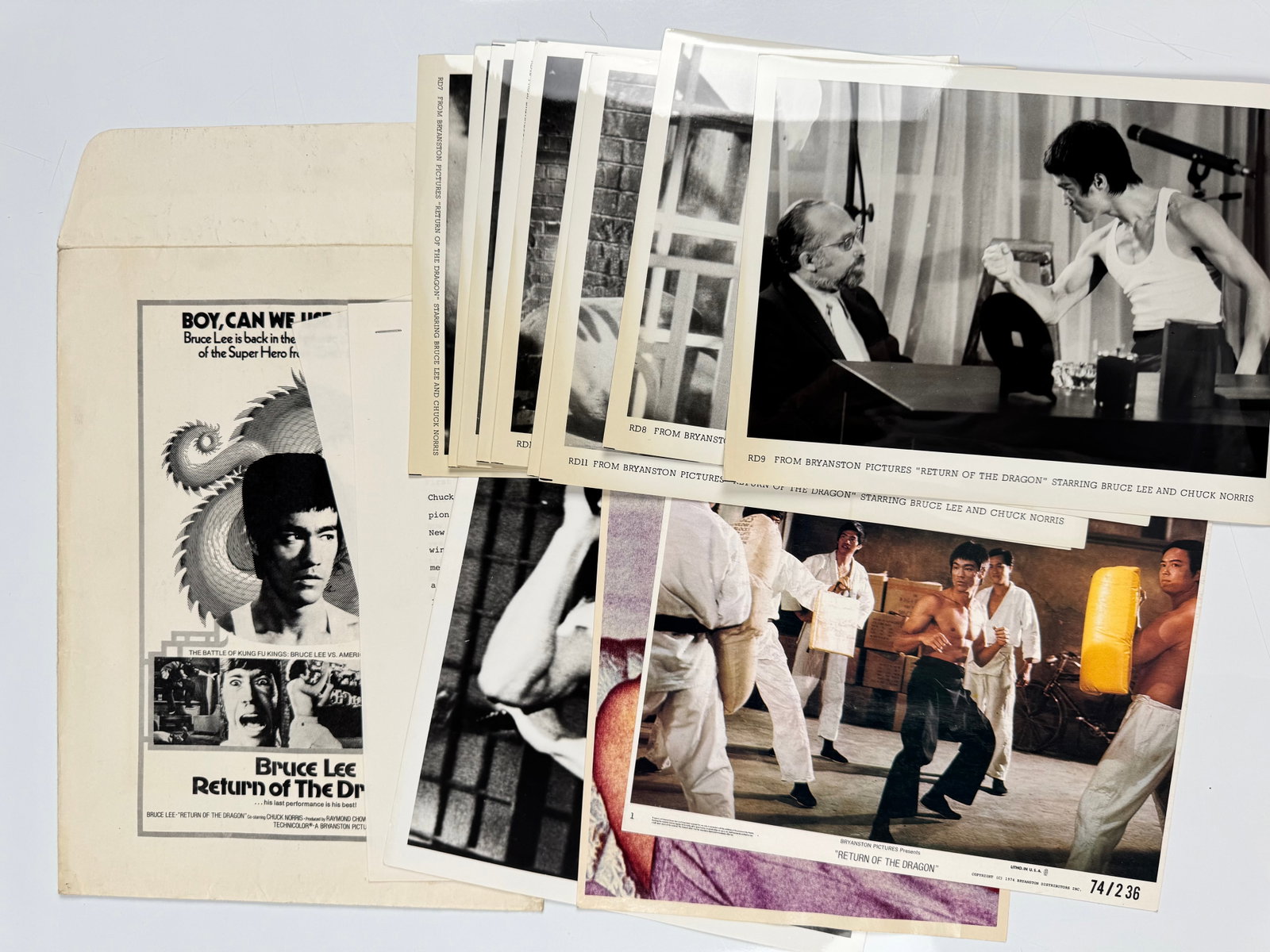 Bruce Lee Return of the Dragon 1974 Bryanston Original Film Press Kit Stills Lobby Card Ephemera Lot: Mixed archive lot of period promotional material issued by Bryanston Pictures for the 1974 US release of Return of the Dragon. The group includes a press-kit envelope, black-and-white captioned studio