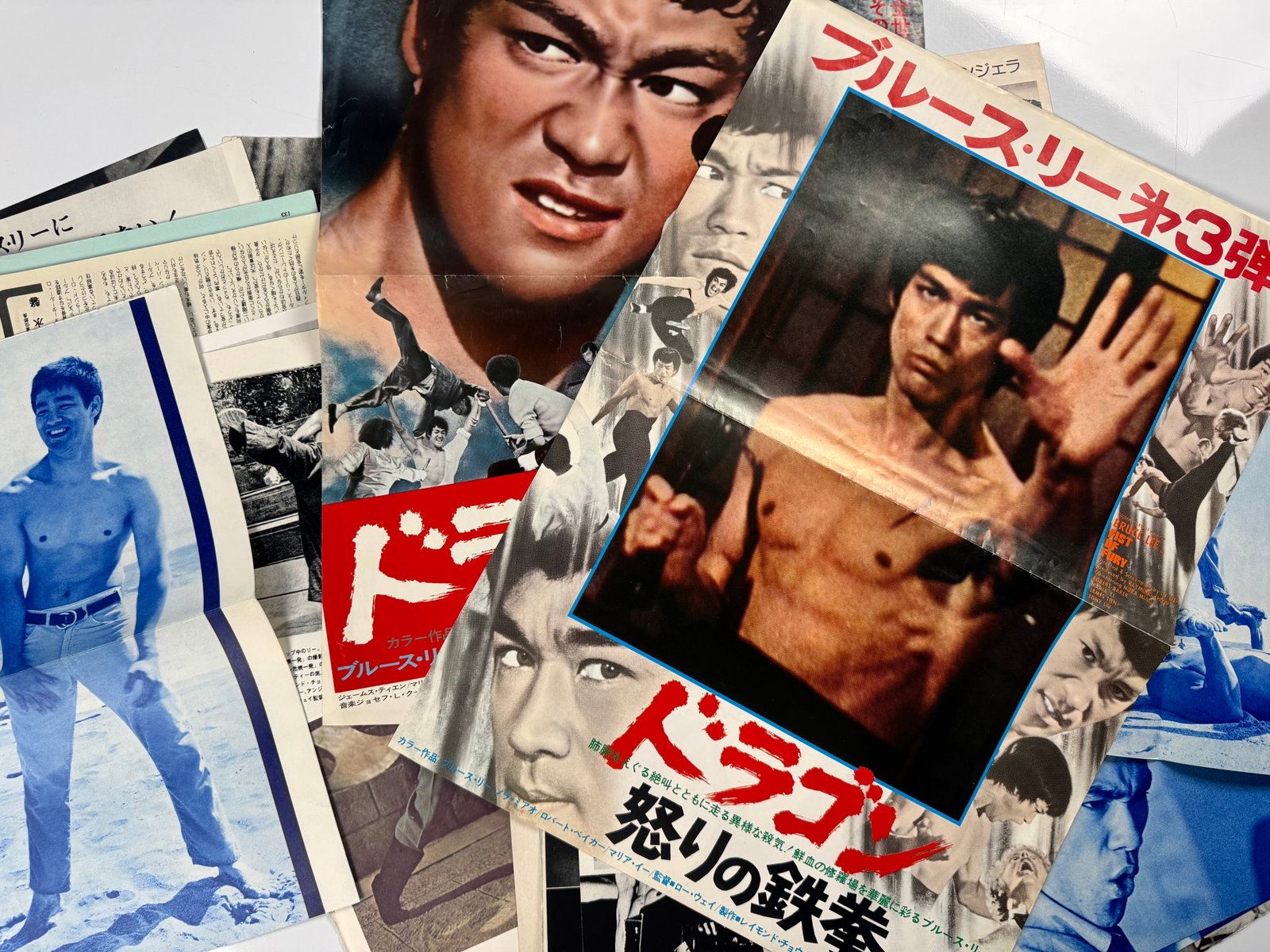 Bruce Lee Fist of Fury Big Boss 1974 Japanese Magazine Posters Clippings Martial Arts Ephemera Lot: Mixed Japanese-language Bruce Lee ephemera lot centered on Fist of Fury and The Big Boss, both released theatrically in Japan by Towa in 1974. Contents include magazine pages, photographic centerfolds