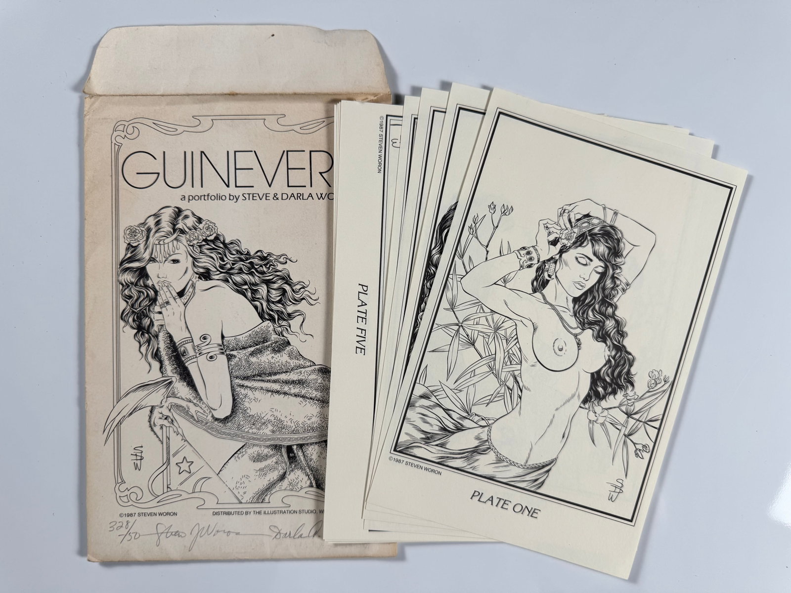 Steve Darla Woron Guinevere 1987 Signed Fantasy Erotic Art Portfolio No 328/750 Complete Plate Set: Steve Woron is an American independent comic book writer, publisher, and illustrator who co-founded The Illustration Studio in the 1980s. His portfolio work specialized in fantasy, science fiction, an