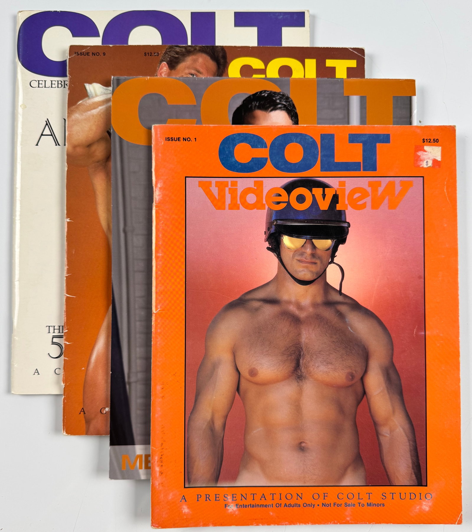 Colt Studio Gay Interest Lot of 4 Videoview All-American Jocks Anniversary Albums 2021 Calendar Art: Lot of four Colt Studio publications comprising Colt Videoview Issue No. 1 from 1986, Colt Studio Presents Issue No. 9: All-American Jocks from 1987, The Anniversary Albums: The 50 Superstars Part 2 f