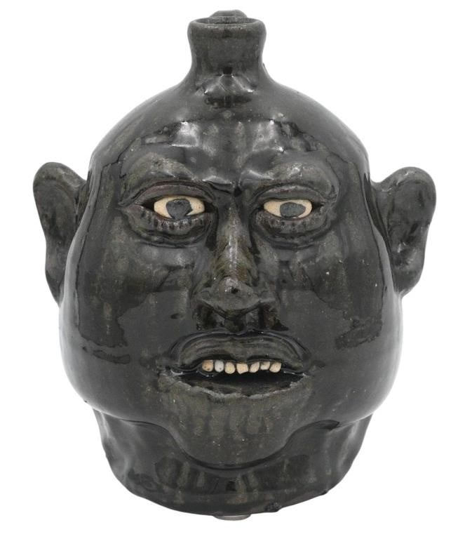 Lanier Meaders. Face Jug: Lanier Meaders. (1917-1998) Face Jug. Early 1980s. Signed. Kaolin teeth and eyes, ash glaze. Mint Condition. Size: 9.5" H. Provenance: Private Georgia Collection. Est. $1,000 - $2,000.