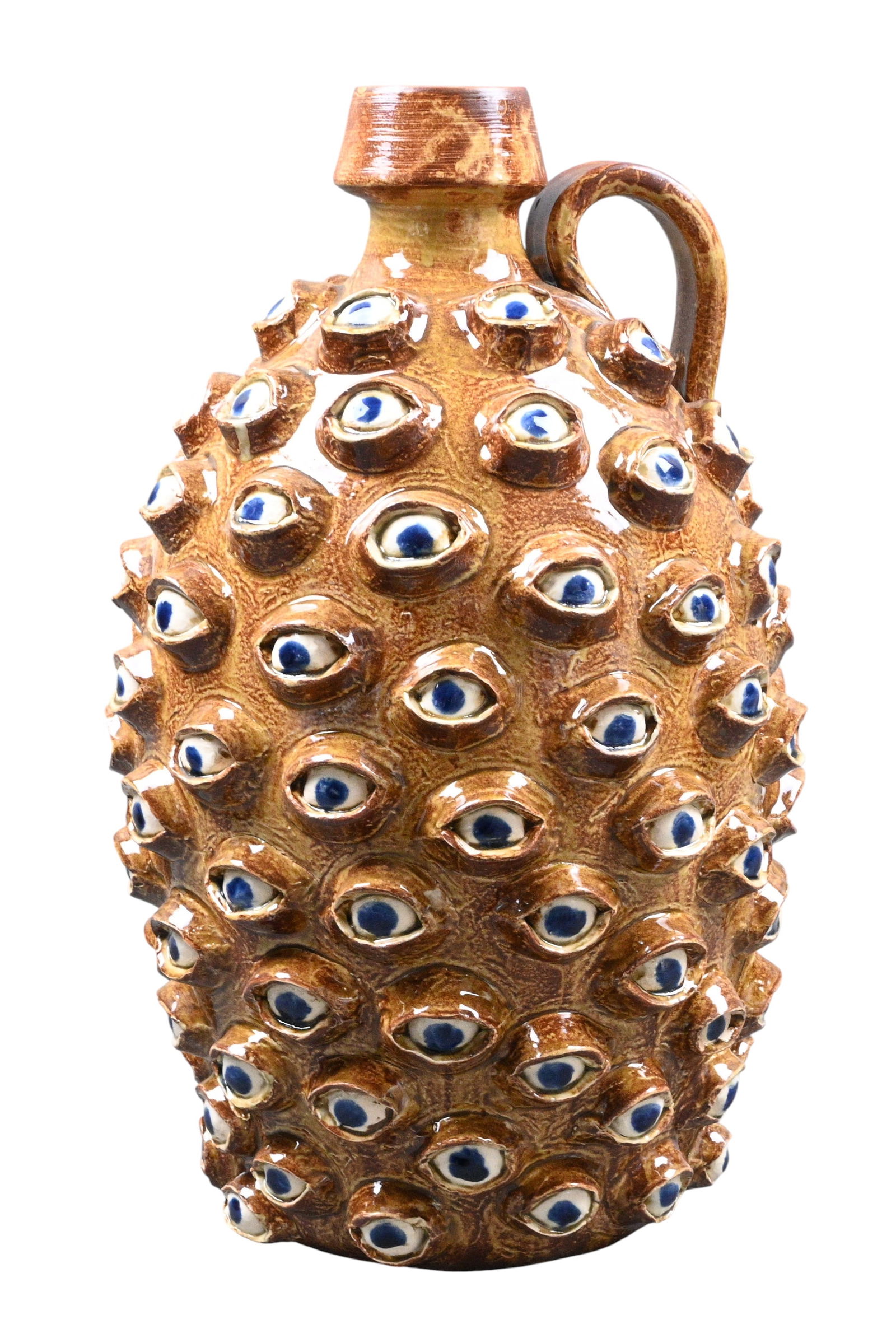 Randy Tobias. Eyeball Jug: Randy Tobias. Eyeball Jug.Signed. 112 eye balls surrounding the jug. Written on the bottom: "Free advice, don't let the same snake bite you twice" written on the bottom. Randy has been a master