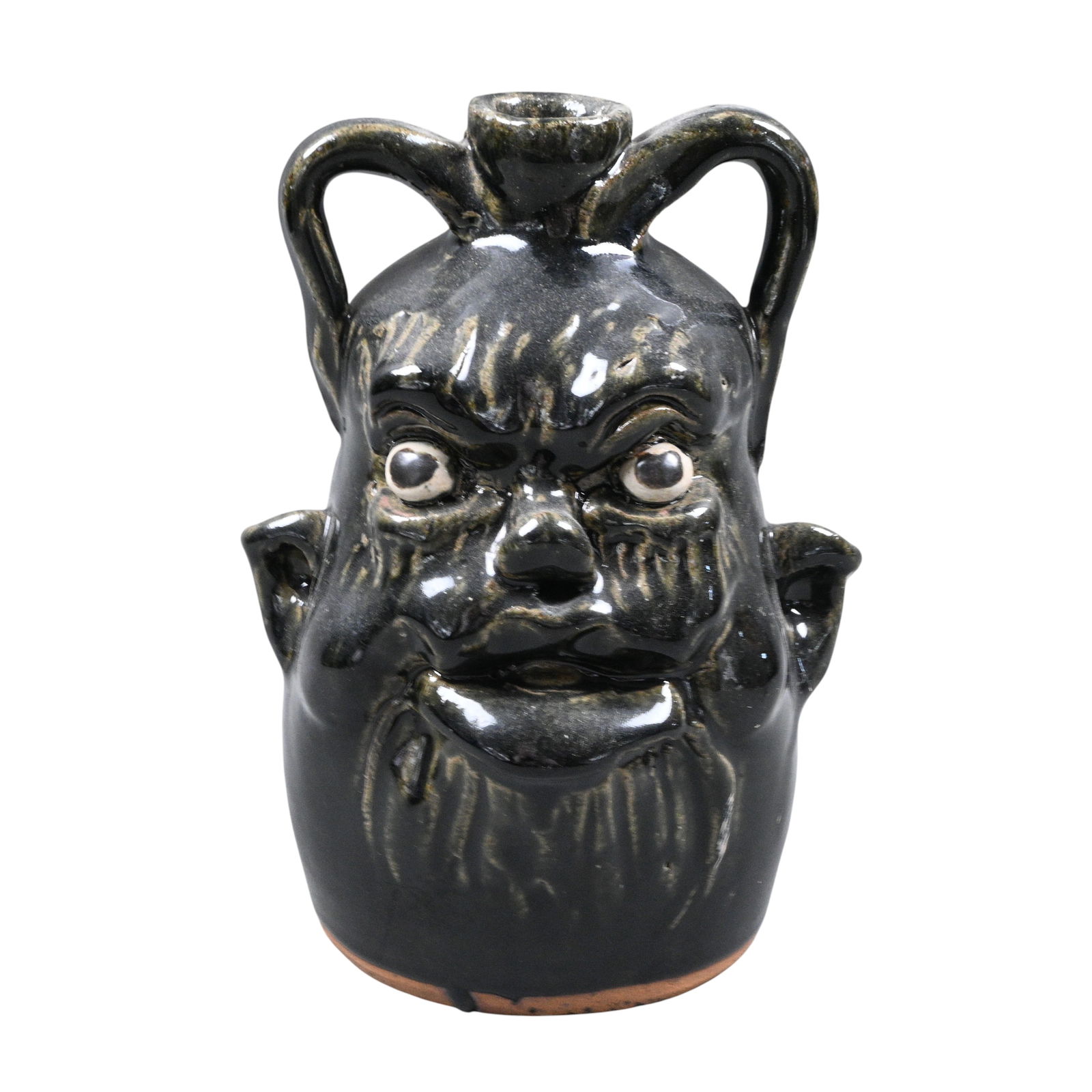 Clete Meaders, Jr. Double Handle Face Jug: Clete Meaders, Jr. (1921-2003) Double Handle Face Jug. Signed. 65 on bottom. Mint condition. Size: 8.5" H. Provenance: Private Georgia Collection. Est. $200 - $400. Ship: In-House Shipping Available.