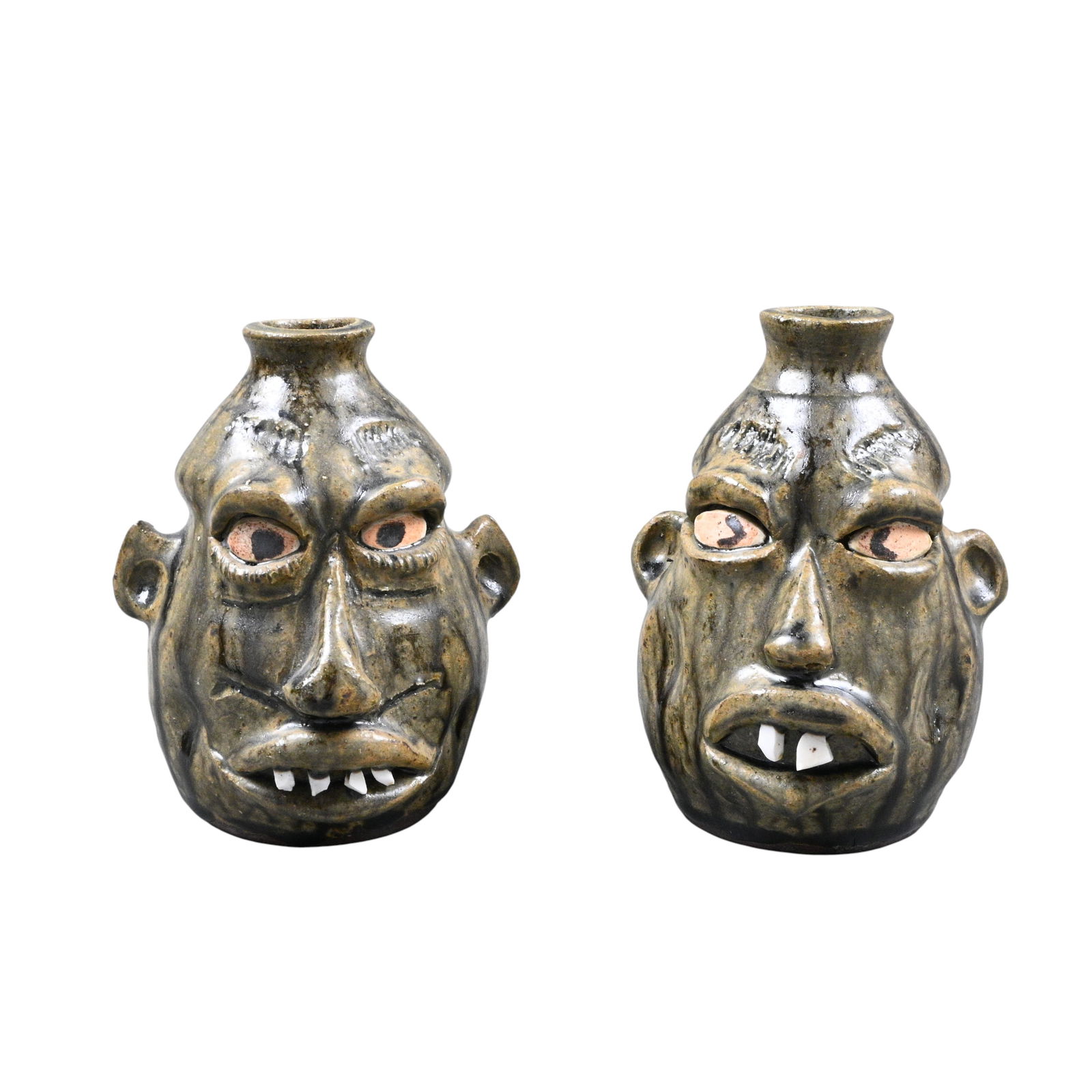 Wayne Hewell. Pair of Small Face Jugs: Wayne Hewell. (b. 1959)Pair of Small Face Jugs.2000. Signed and Dated. Mint condition. Size: 5.5" H. Provenance: Private Georgia Collection. Est. $100 - $300. Ship: In-House Shipping