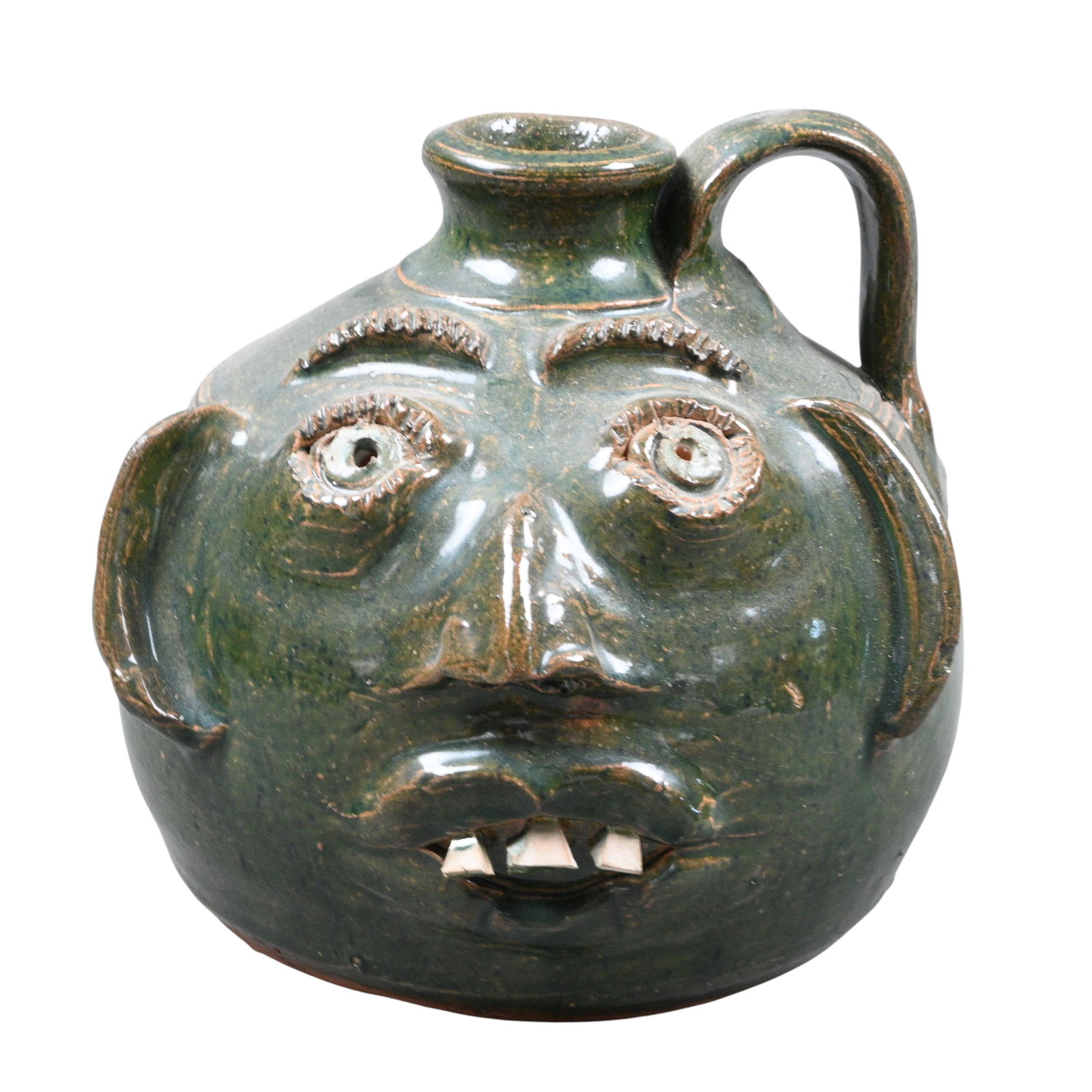 Bobby Ferguson. Green Short Face Jug: Bobby Ferguson. (1933-2005)Green Short Face Jug.Signed. Mint condition. Size: 5.75" H. Provenance: Private Georgia Collection. Est. $200 - $400. Ship: In-House Shipping Available.
