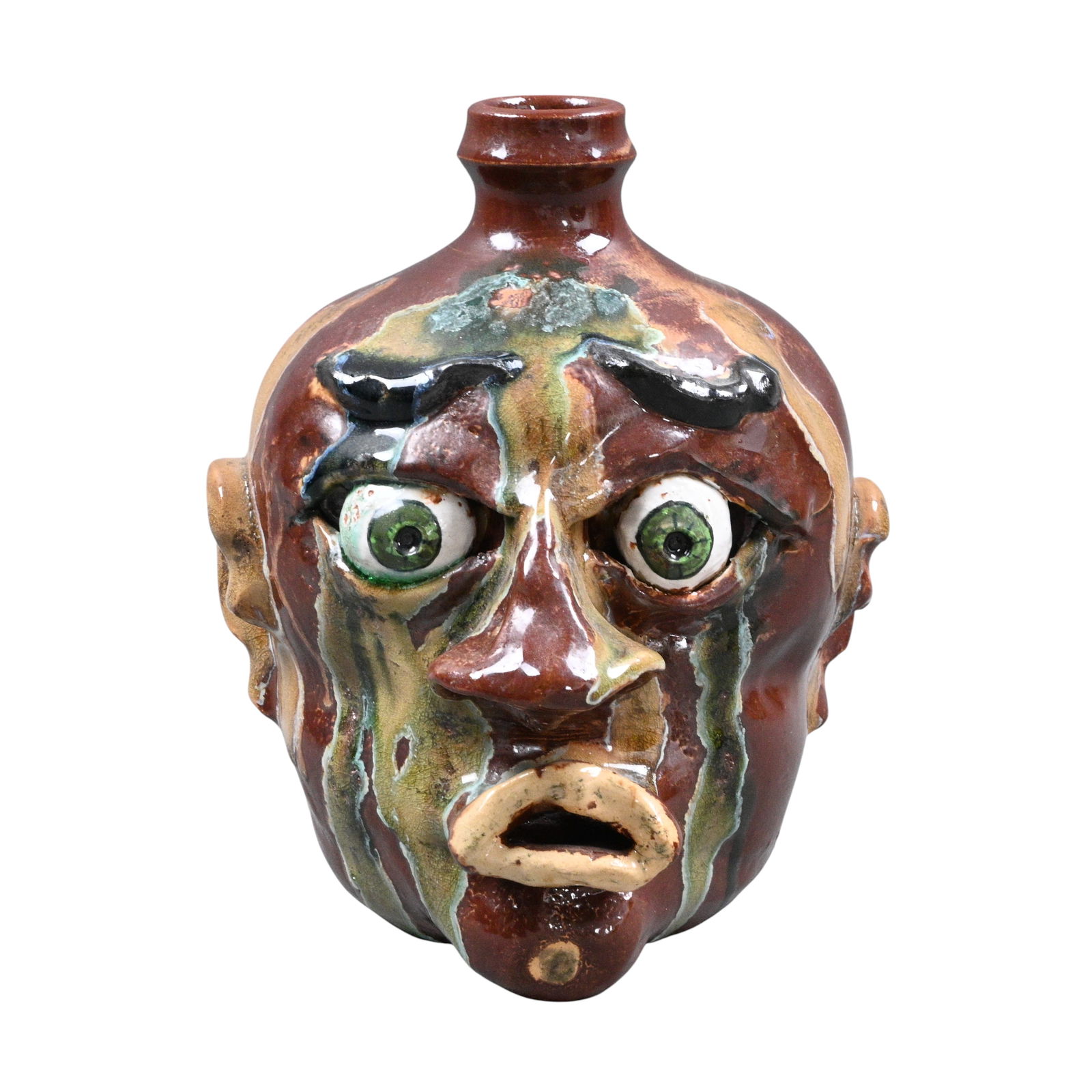 Archie Teague. Face Jug: Archie Teague. (1935-1998)Face Jug.Signed. Beautiful multicolored glaze drips. Mint condition. Size: 8.25" H. Provenance: Prominent Private Kentucky Collection. Est. $100 - $300. Ship: