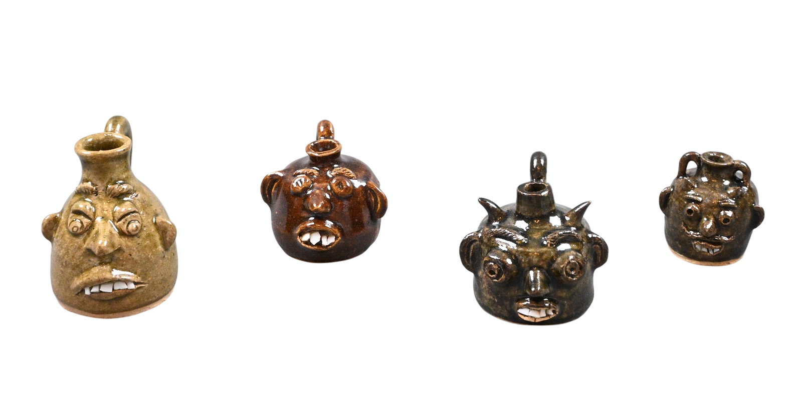 Kathy Richards. Four Mini Face Jugs: Kathy Richards. Four Mini Face Jugs.Signed. One dated 1997. Excellent condition. Size: Largest is 2.25" H. Provenance: Larry Hackley Collection. Est. $100 - $300. Ship: In-House Shipping