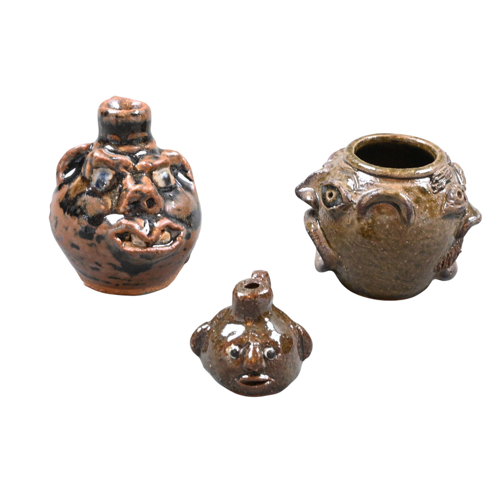 Marie Rogers, Rodney Leftwich, and Jessie Meaders. Mini Face Jugs: Marie Rogers, Rodney Leftwich, and Jessie Meaders. Mini Face Jugs.Signed. Jessie Meaders is dated 1998. Provenance: Larry Hackley Collection. Est. $100 - $300. Ship: In-House Shipping Available.