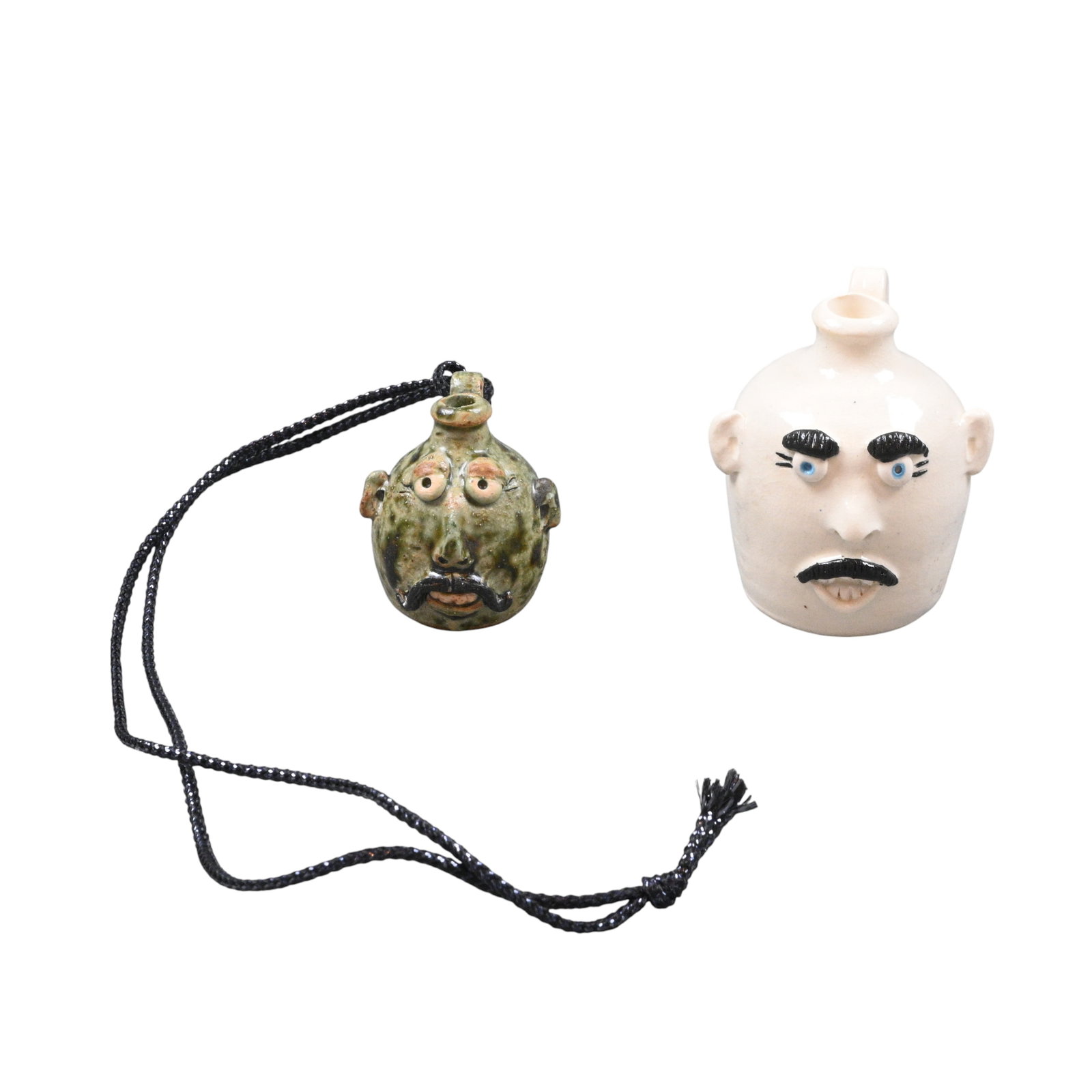 Shirley Criscoe. Mini Face Jugs: Shirley Criscoe. Mini Face Jugs.1999, 2001. Signed and Dated. One is made out of necklace, but the string can be removed. Excellent condition. Size: Largest is 2.5" H. Provenance: Larry