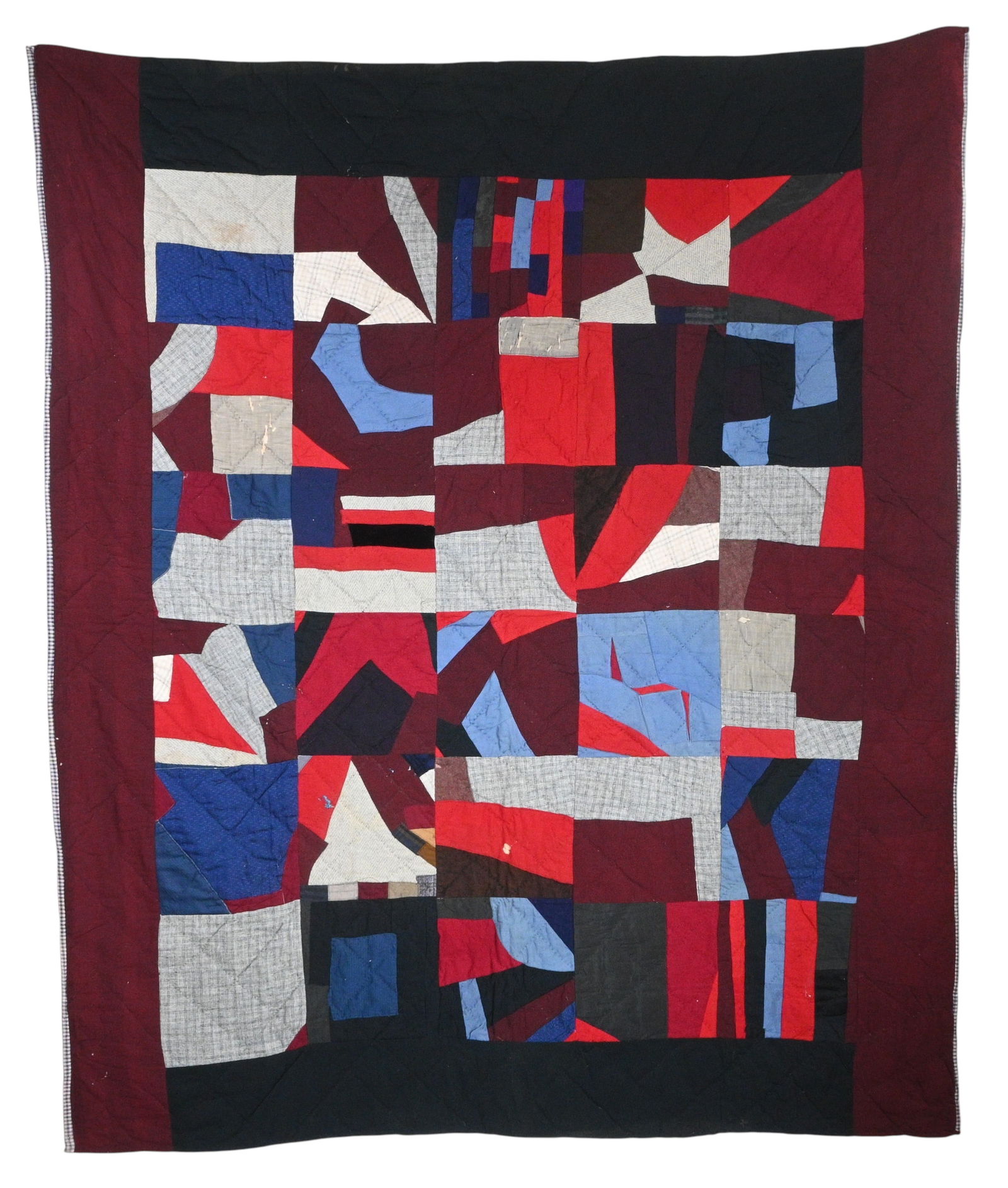 Patchwork Quilt: Patchwork Quilt. A quilt, pieced in blocks, with a burgundy and black border. The fabrics are cotton and wool, with lots of variation in texture, and some very small scraps used. The back is dark blue